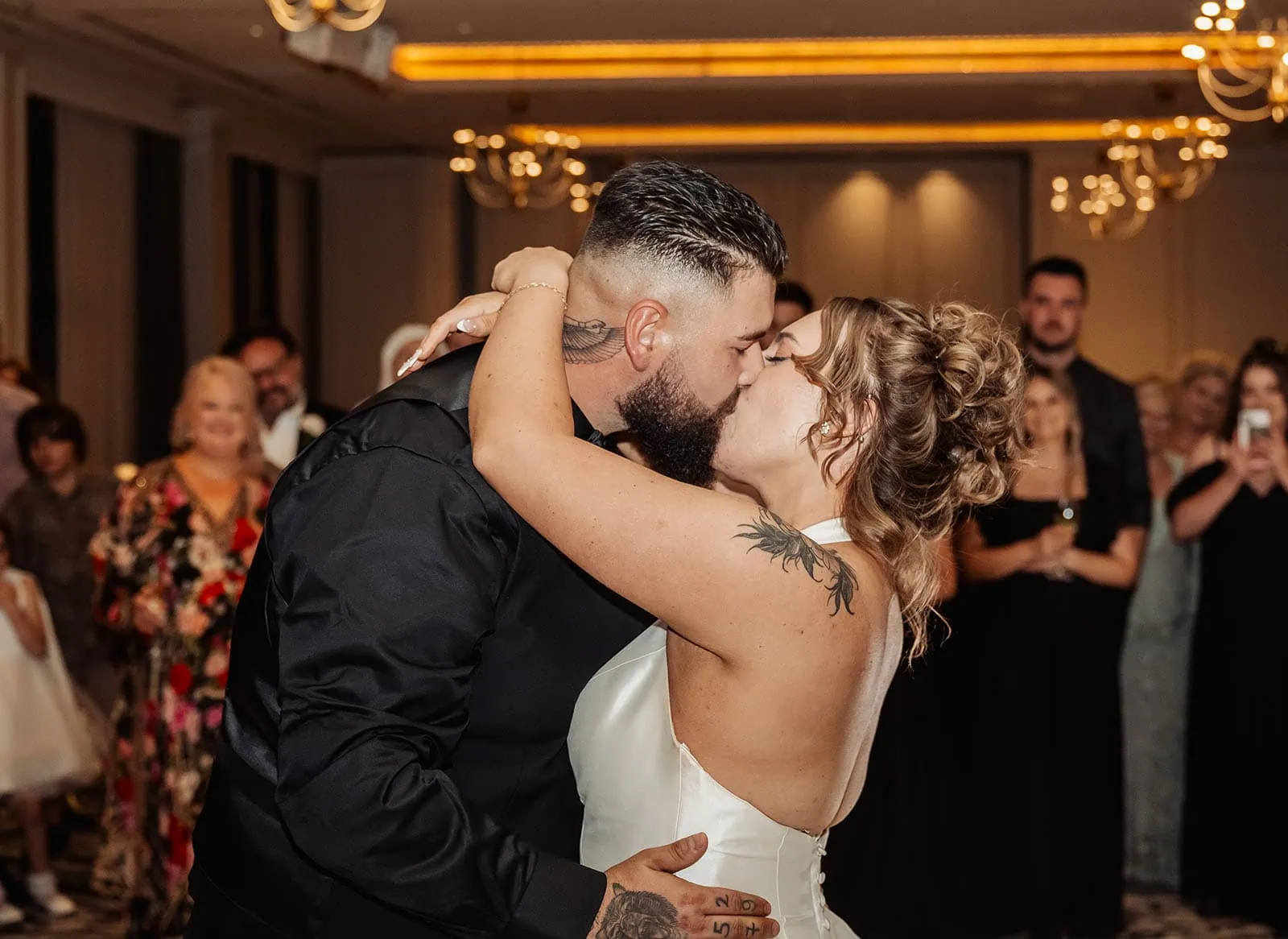 botanic gardens, araucaria avenue wedding - jade & hazim 78 Tattooed bride and groom sharing intimate kiss at their wedding reception.