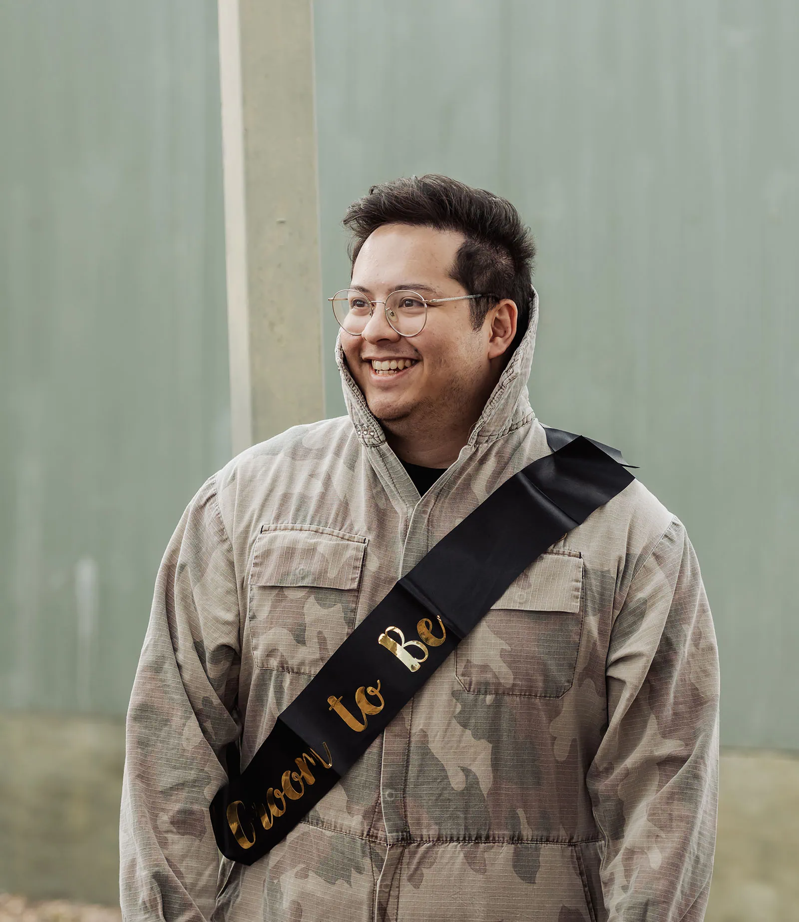 monarto delta force bucks vs hens paintball party 3 Groom-to-be in camouflage jacket smiling outdoors.