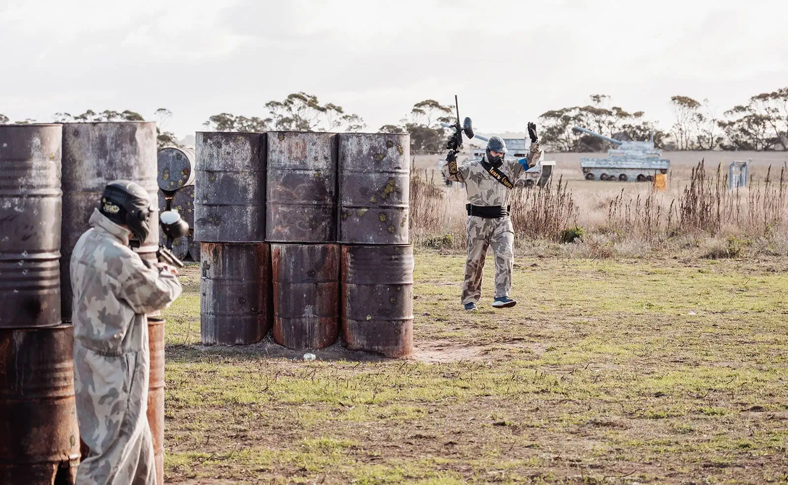 monarto delta force bucks vs hens paintball party 29 Paintball game action with players in camouflage on a tactical field.