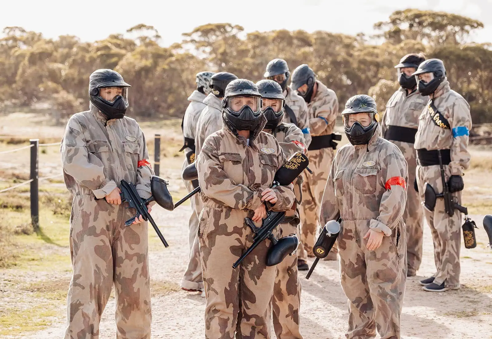 monarto delta force bucks vs hens paintball party 23 Paintball players in camouflage gear preparing for an outdoor game.