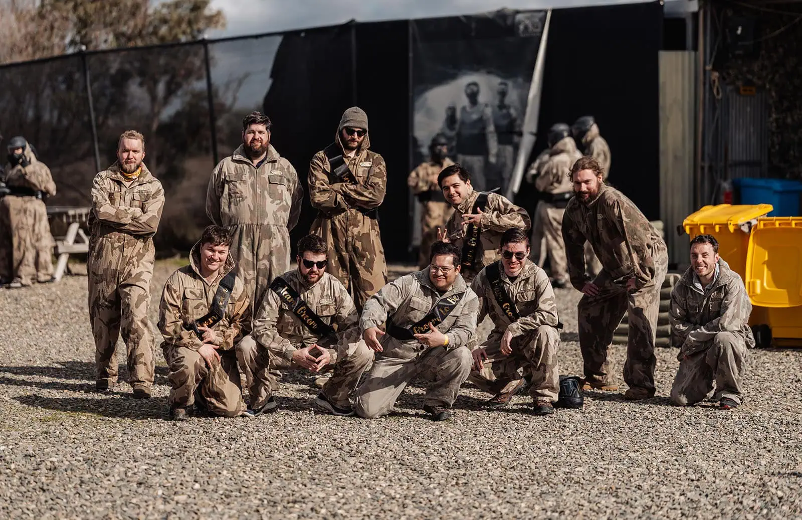 monarto delta force bucks vs hens paintball party 5 Group photo of paintball players in camouflage gear outdoors.