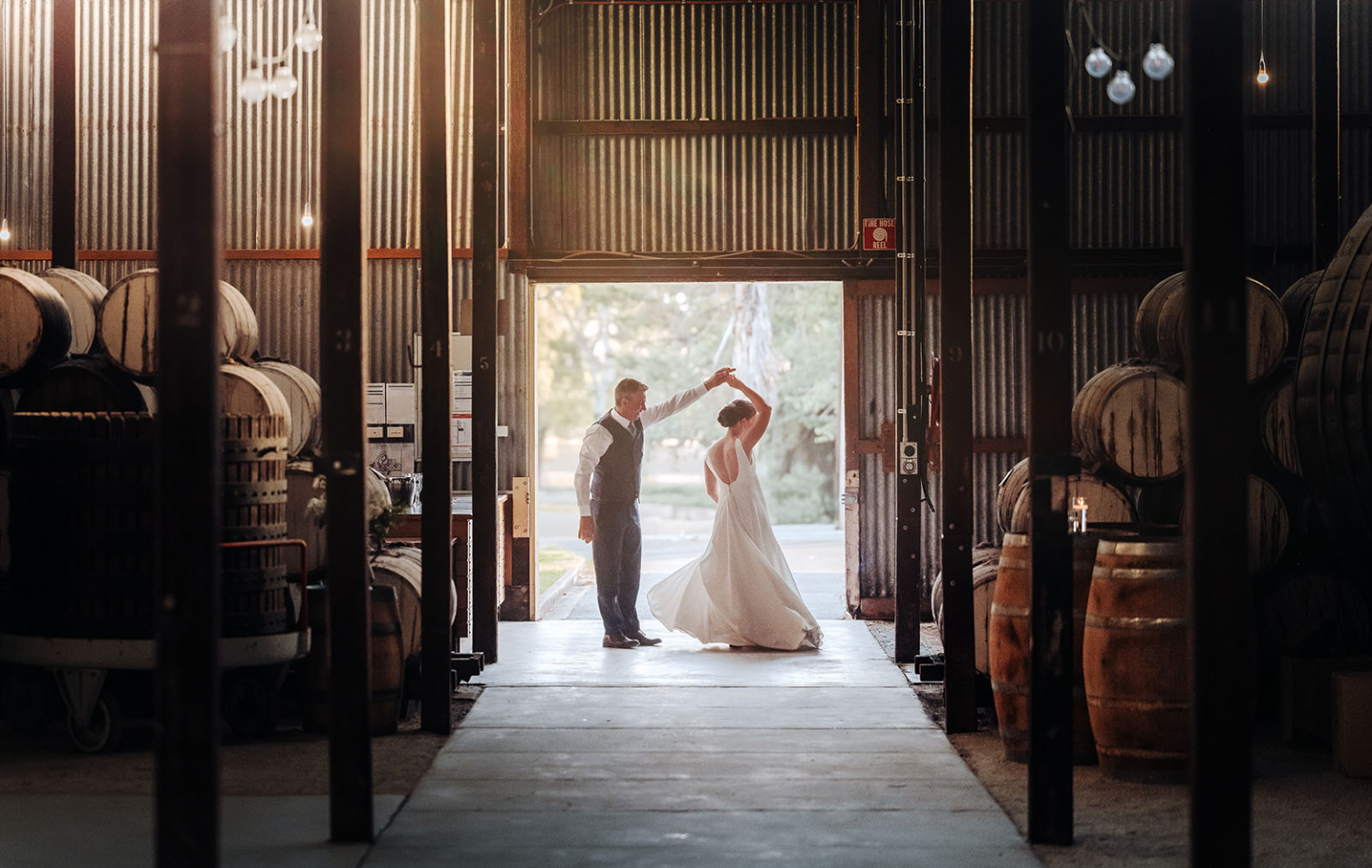 how to choose a destination wedding photographer | 2025 guide 3 Romantic couple dancing in a rustic barn with warm light and vintage charm.