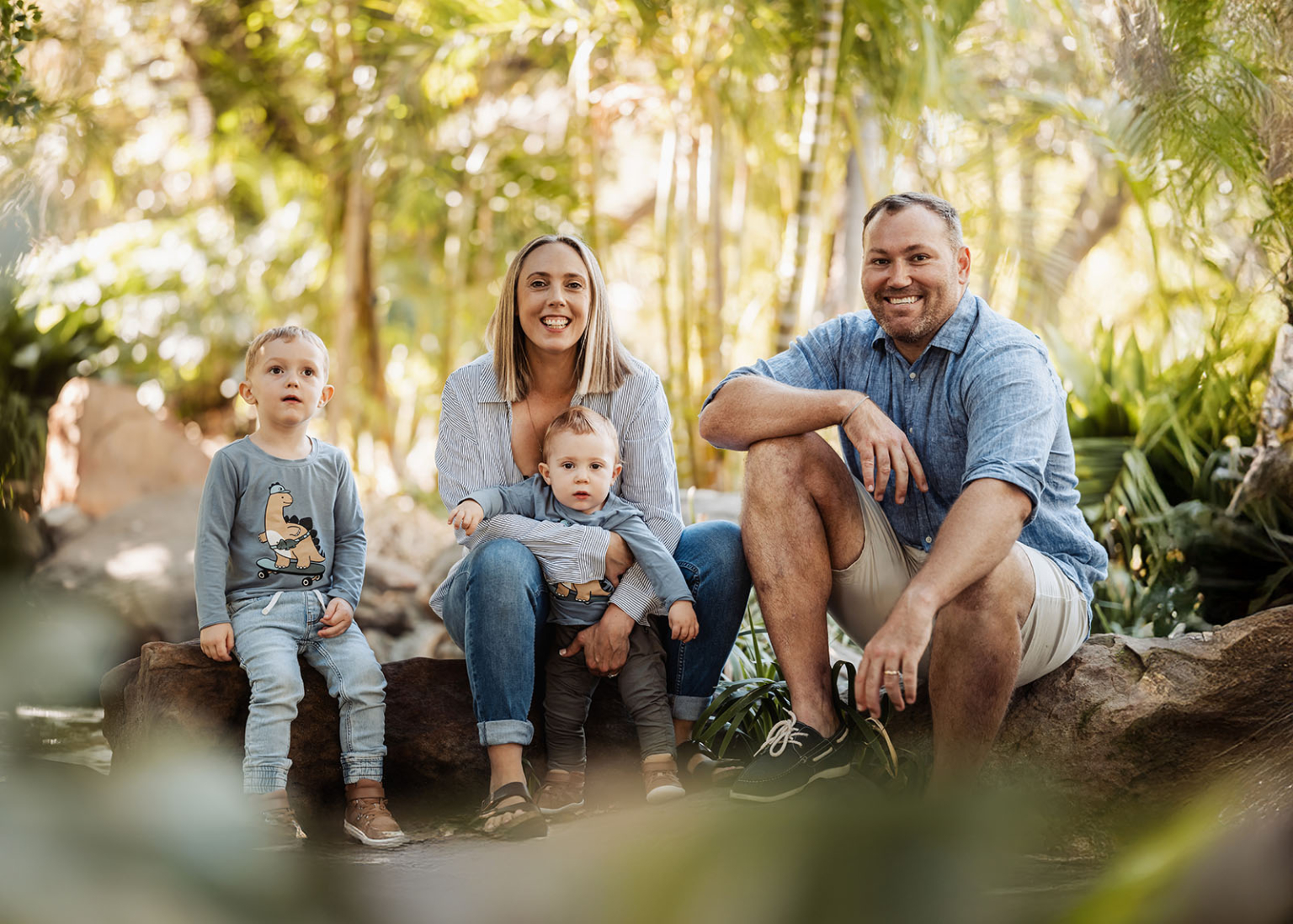 veale gardens family photography 110 Happy family portrait in nature featuring parents with children embracing sunlight and greenery.