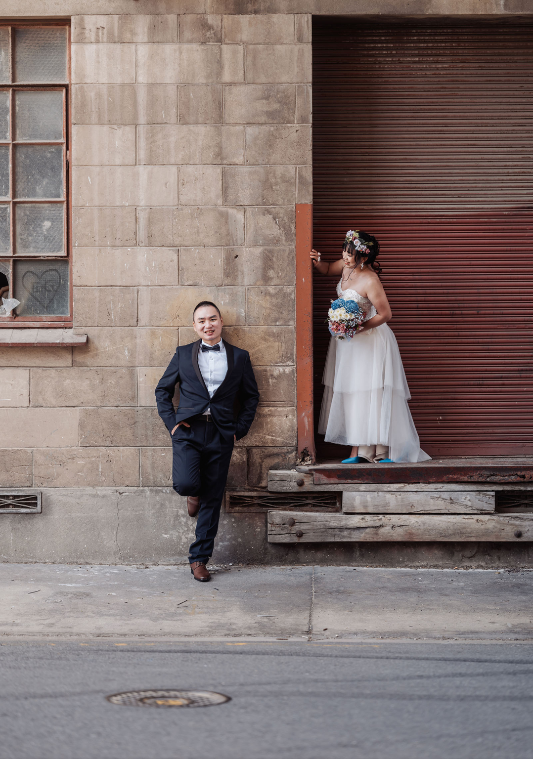 bumbunga lake photoshoot - tina & eric 54 Bride and groom in urban setting with rustic industrial vibe and colorful bouquet.