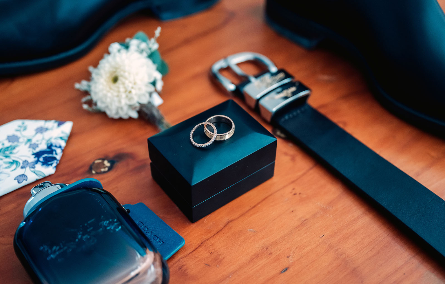 wedding at kuitpo hall - sophia & sam 83 Elegant wedding accessory set: rings, cologne, boutonniere, belt, shoe, pocket square.