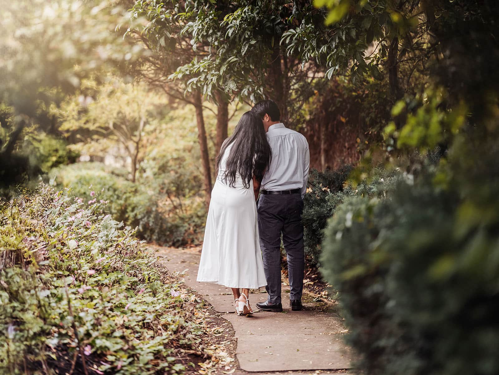 himeji gardens proposal - sam & eugenia 129 Sam and Eugenia walking closely together along a leafy garden path at Himeji Gardens, Adelaide