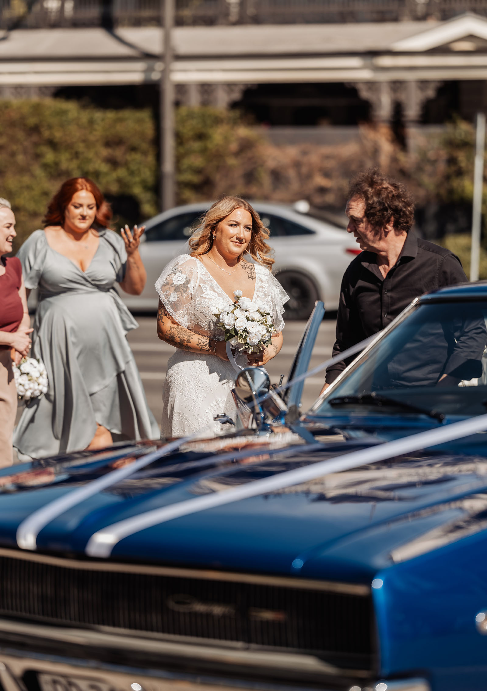botanic gardens adelaide wedding - melanie & adrian 221 Bride in vintage car, elegant wedding scene, classic charm.