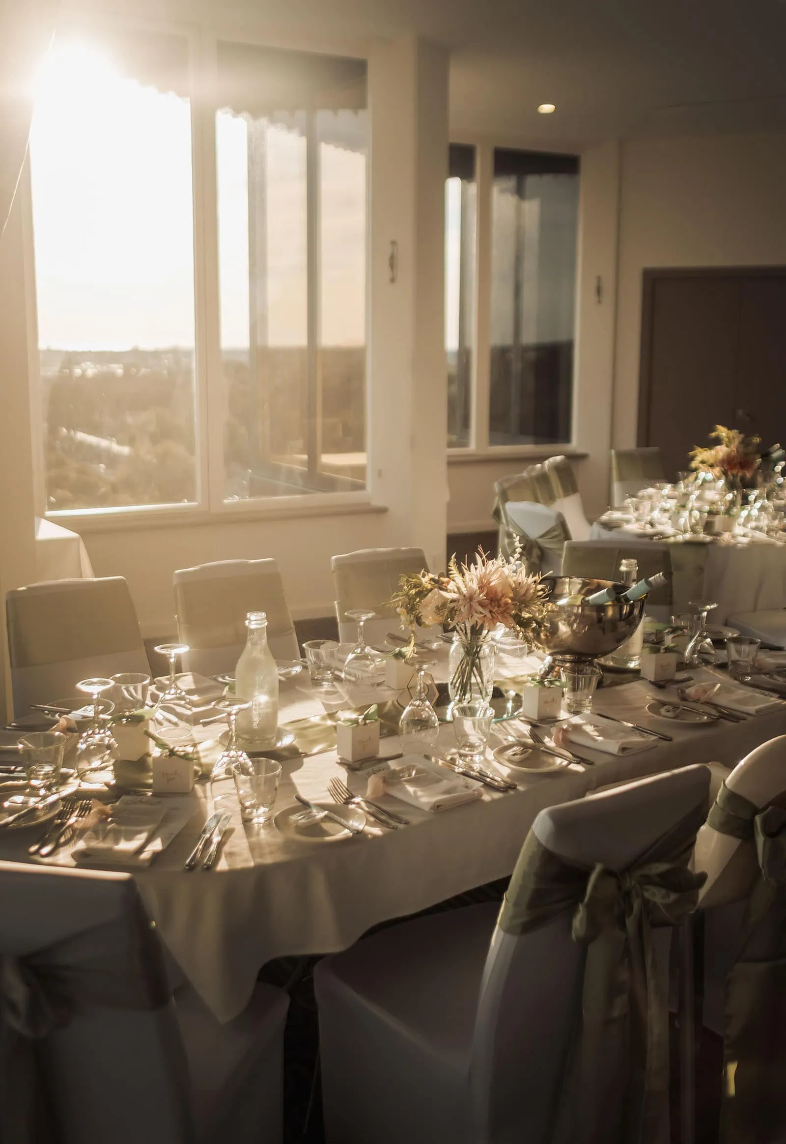 botanic gardens adelaide wedding - melanie & adrian 263 Elegant dining table setup with fine china, glassware, and silverware for a formal dinner.