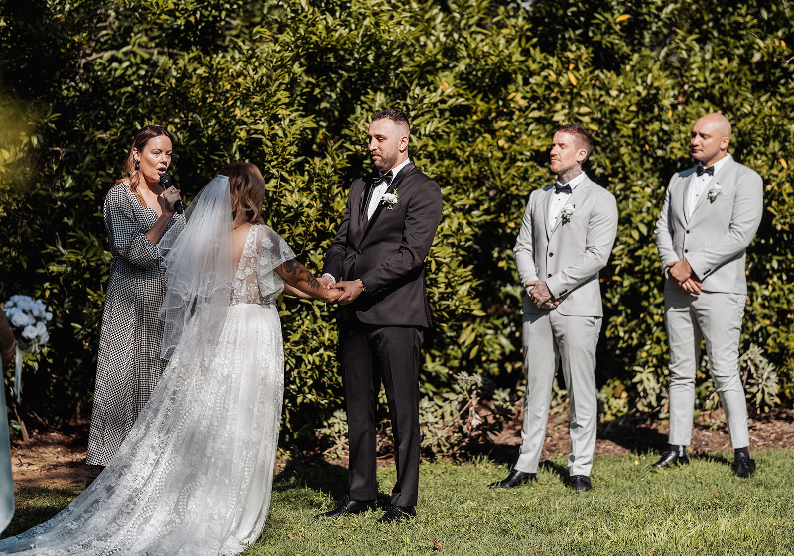 botanic gardens adelaide wedding - melanie & adrian 226 Outdoor garden wedding ceremony with floral arch and elegant seating.
