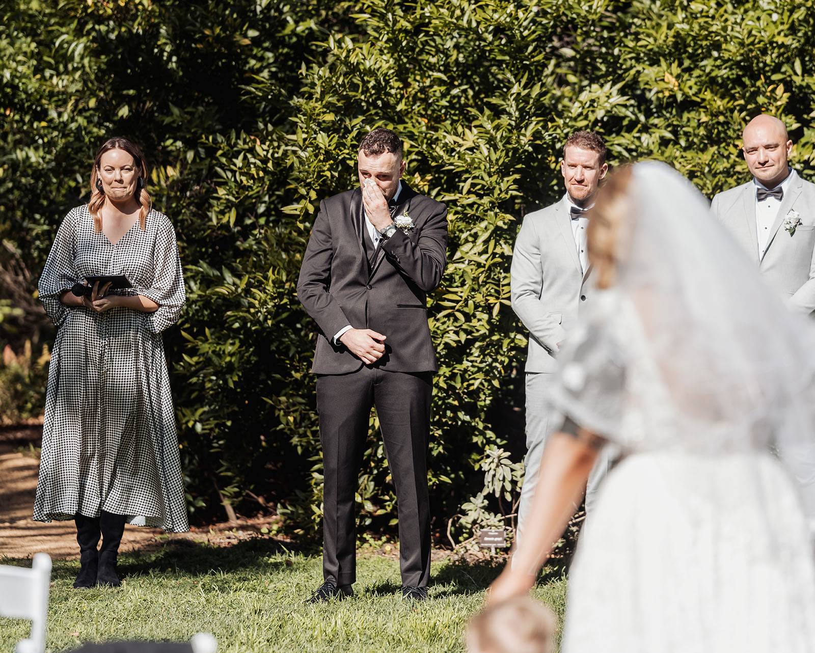 botanic gardens adelaide wedding - melanie & adrian 224 Grooms heartfelt moment during wedding ceremony, capturing pure emotion and joy.