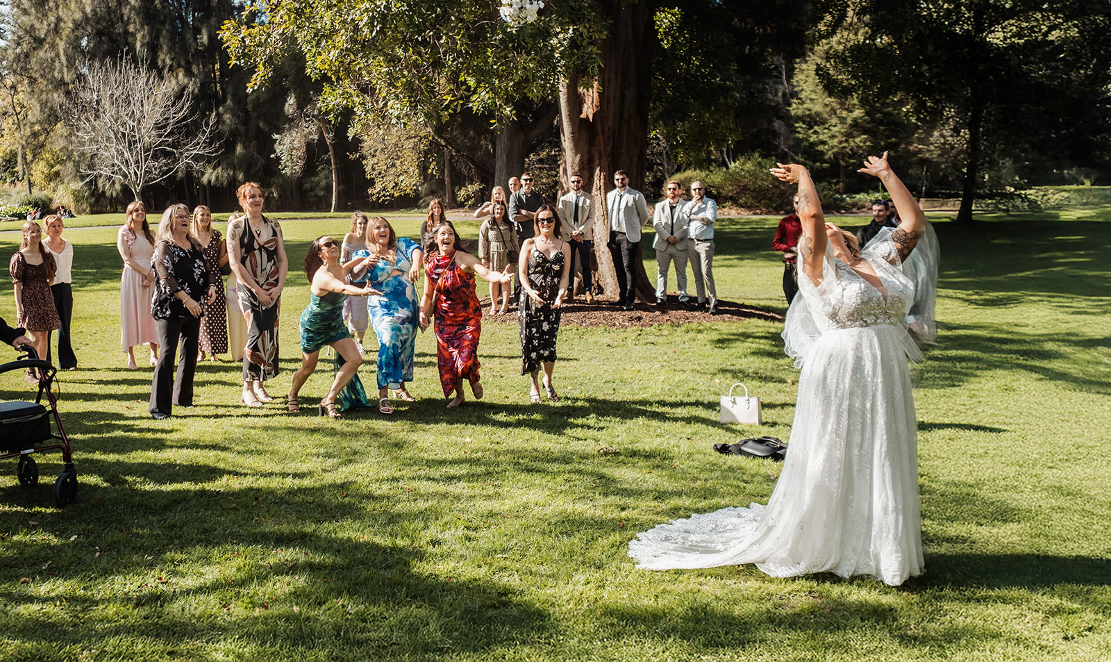 botanic gardens adelaide wedding - melanie & adrian 232 Bride Tossing Bouquet at Outdoor Wedding Reception.