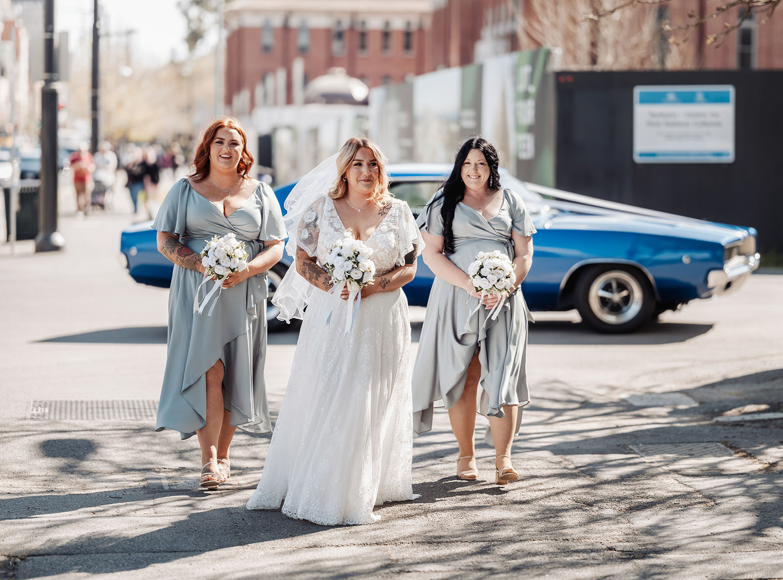 botanic gardens adelaide wedding - melanie & adrian 222 Elegant outdoor wedding with decorated arch and guest seating in a scenic garden.