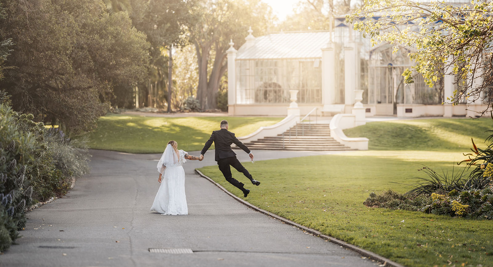 botanic gardens adelaide wedding - melanie & adrian 249 Romantic garden wedding aisle with floral decorations and lanterns.