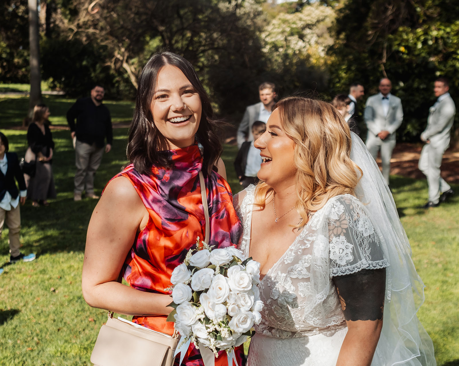 botanic gardens adelaide wedding - melanie & adrian 234 Bride and groom laughing at joyful wedding reception celebration.