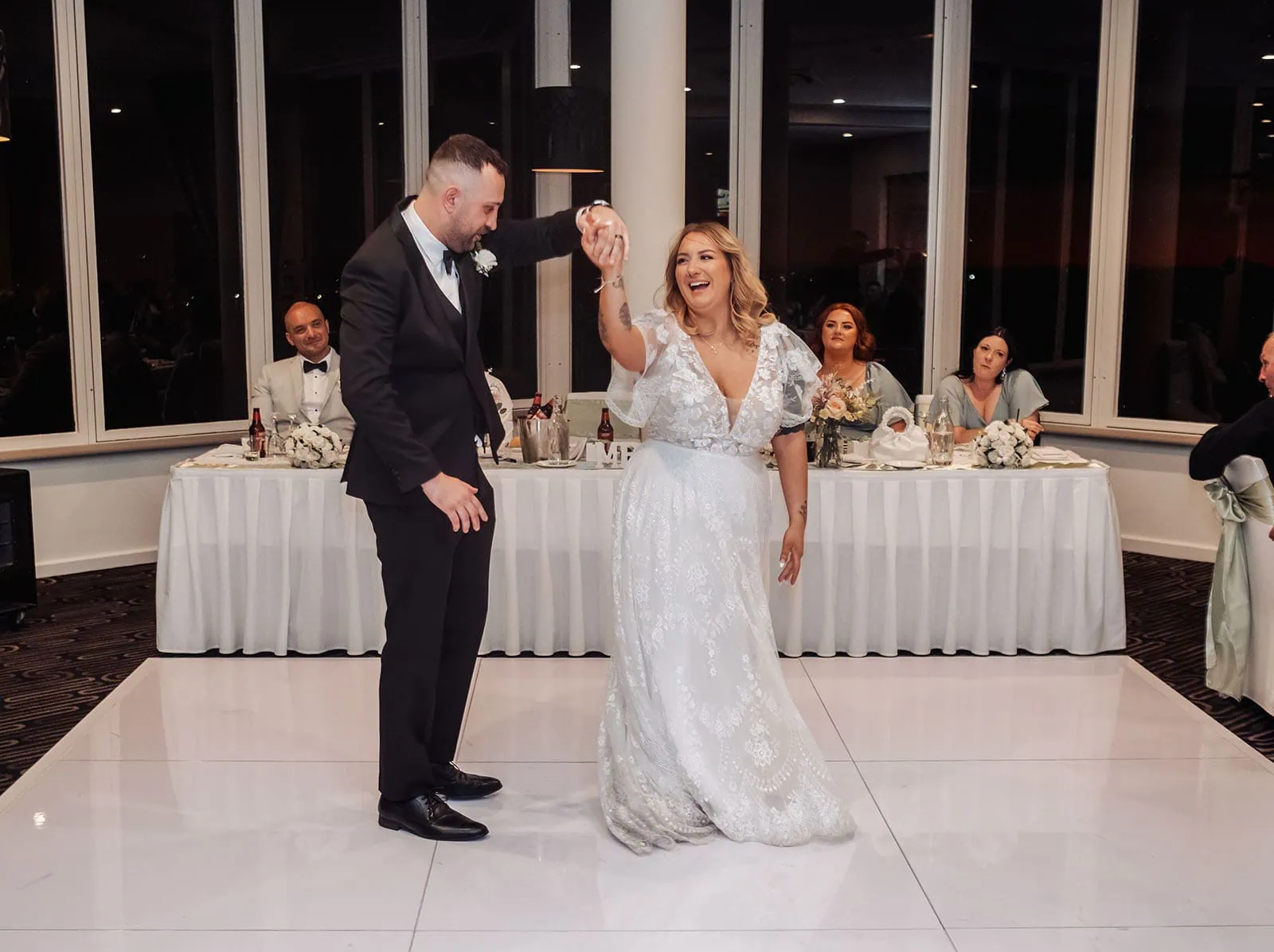botanic gardens adelaide wedding - melanie & adrian 270 Elegant couple shares wedding dance, surrounded by lights and smiles.