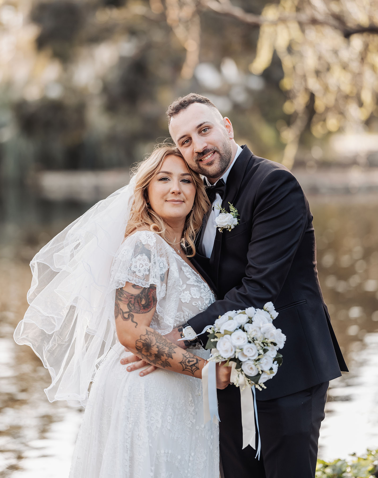 botanic gardens adelaide wedding - melanie & adrian 260 Lakeside wedding at golden hour with a stunning sunset backdrop.