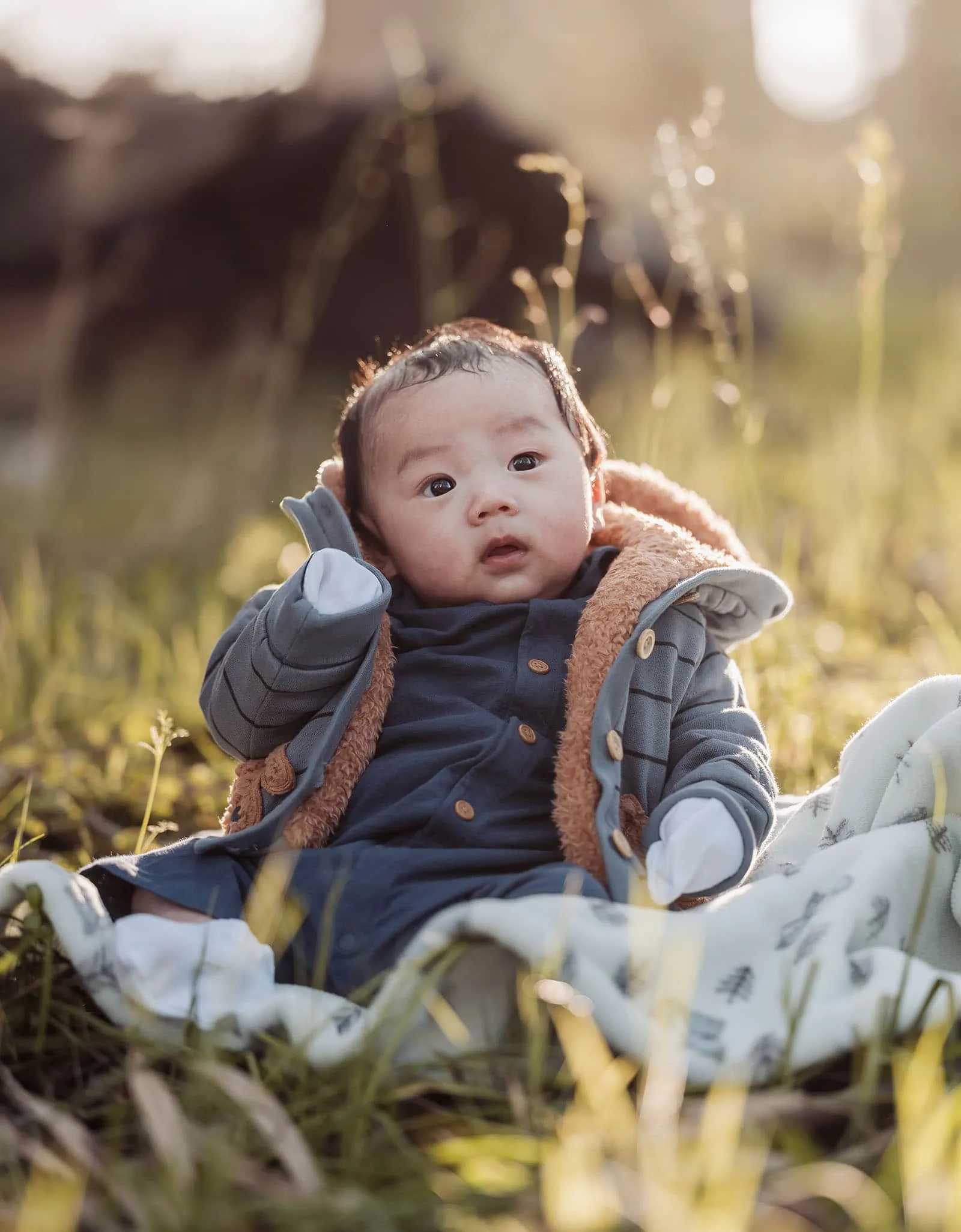 belair family photography 108 Smiling baby enjoying golden hour sunset outdoors.