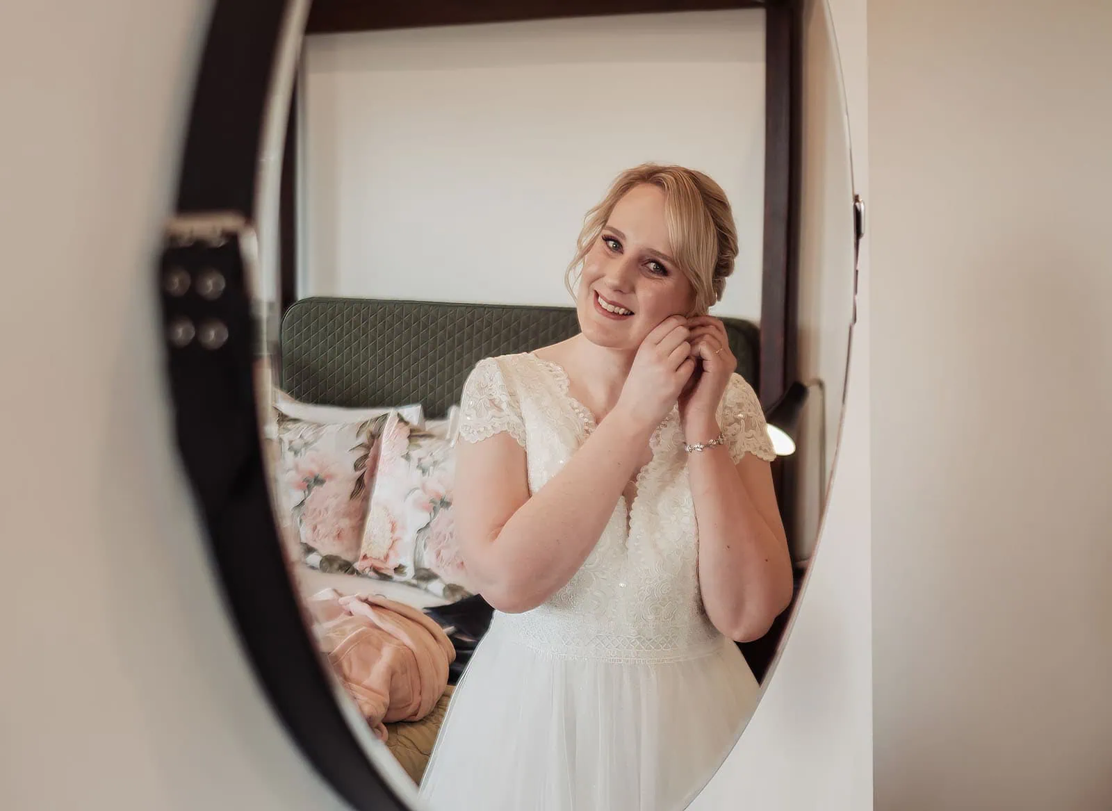 mt lofty house elopement - kimberley & michael 171 Bride getting ready in front of a mirror, wedding preparation scene.