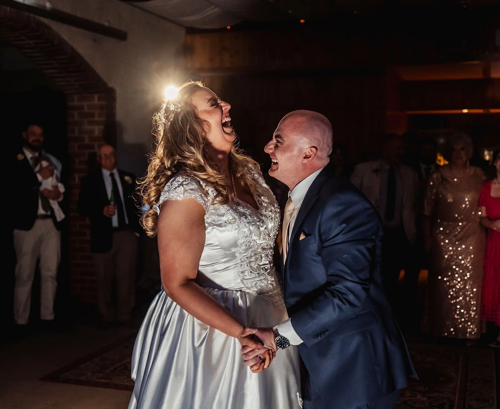 grand cru estate wedding - isabella & nick 166 Bride and groom laughing while dancing at their wedding reception.
