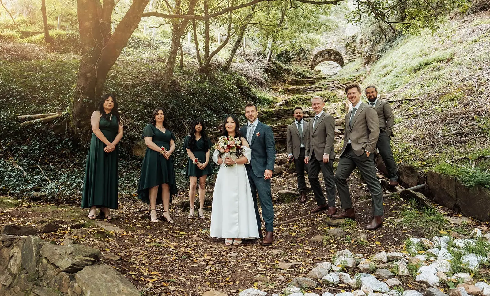 utopia waterfall gully wedding - sally & ben 244 Bride and groom exchange vows in scenic woodland setting.