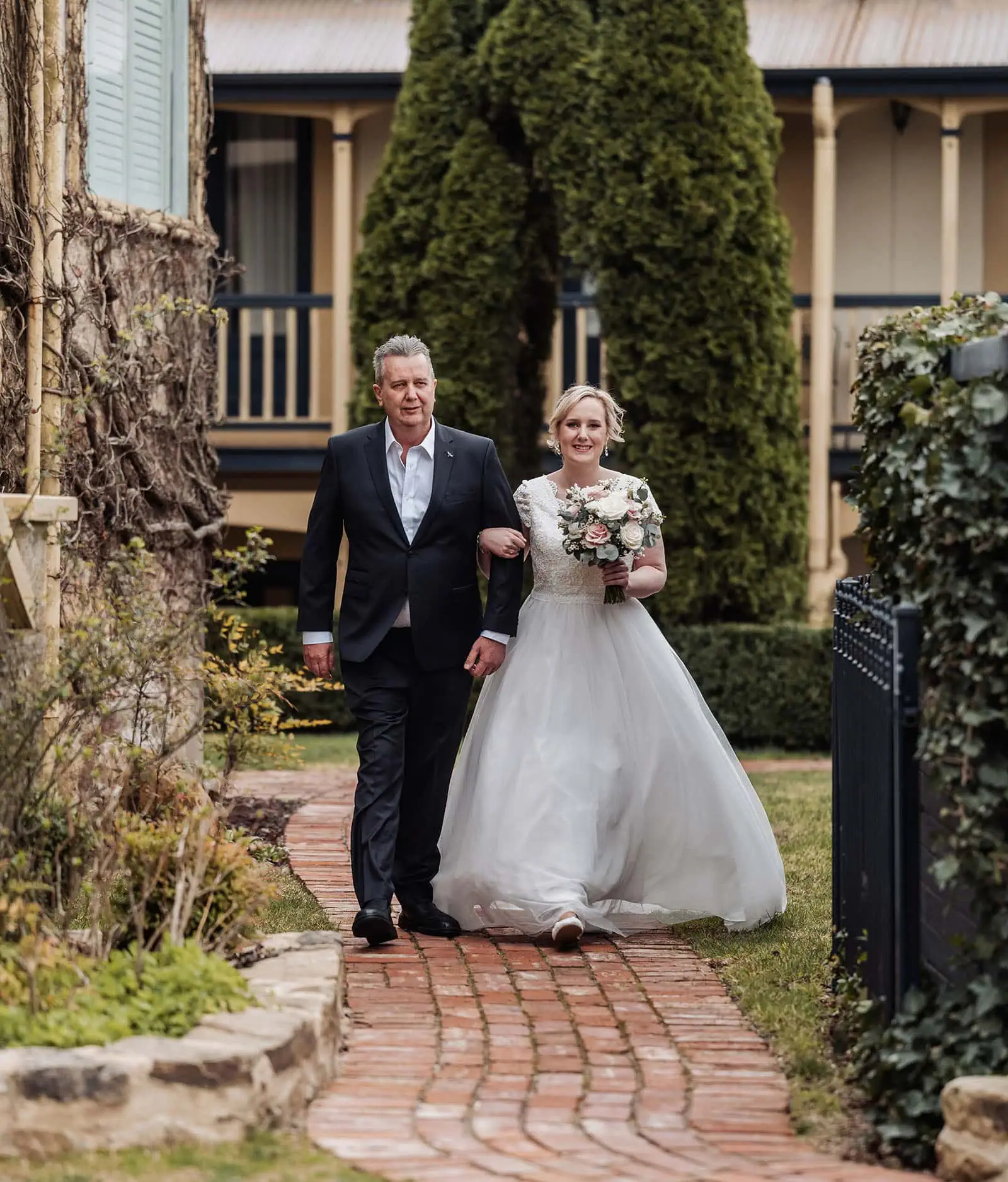 mt lofty house elopement - kimberley & michael 178 Bride walking down aisle during outdoor wedding ceremony.