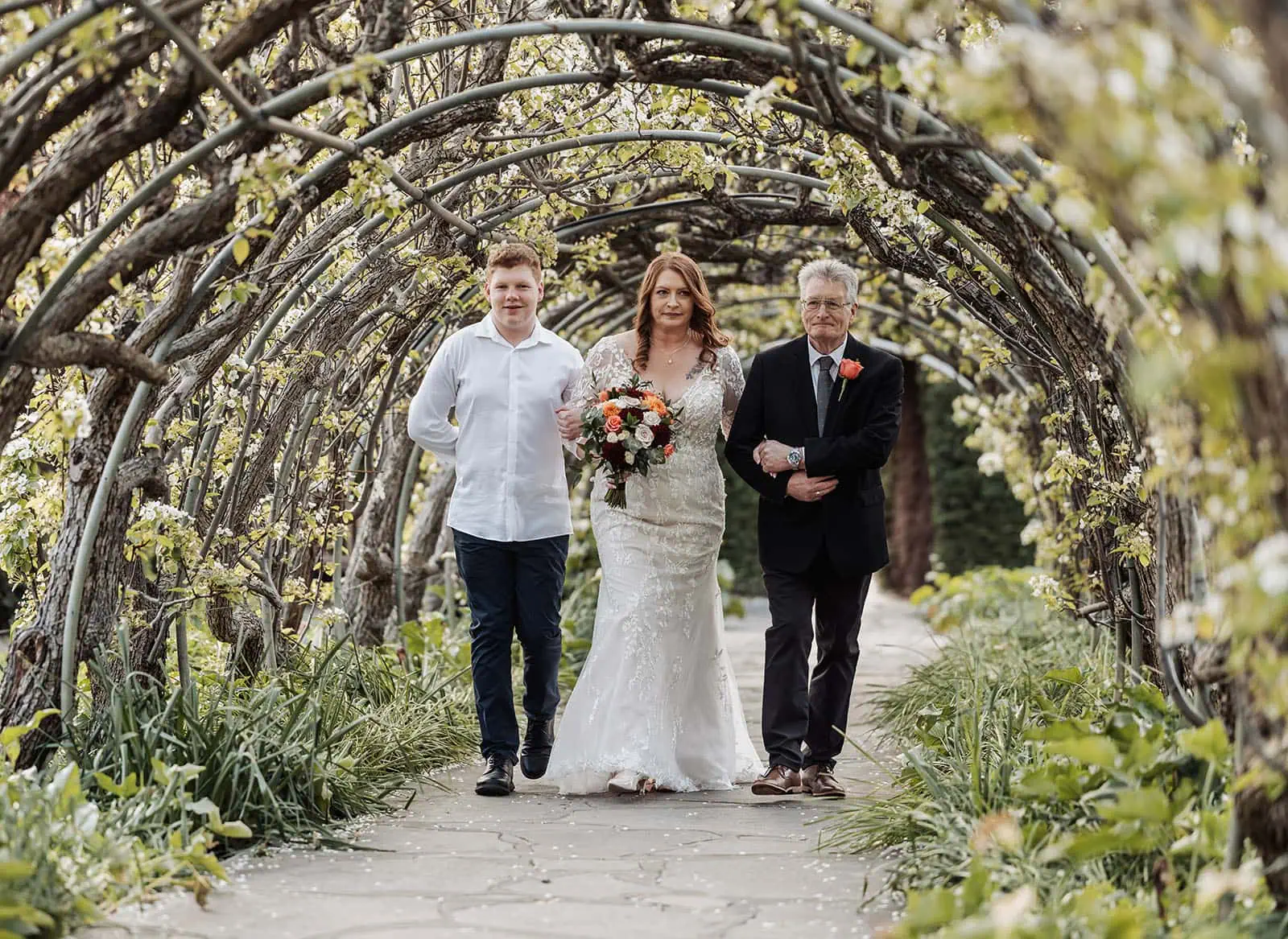 carrick hill wedding - jo & david 289 Bride in elegant gown during outdoor wedding procession.