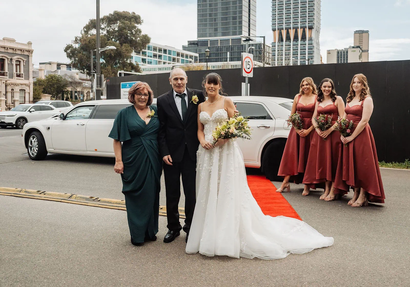 adelaide botanic gardens summerhouse wedding - belinda & ian 159 Bride with parents at elegant city wedding ceremony.