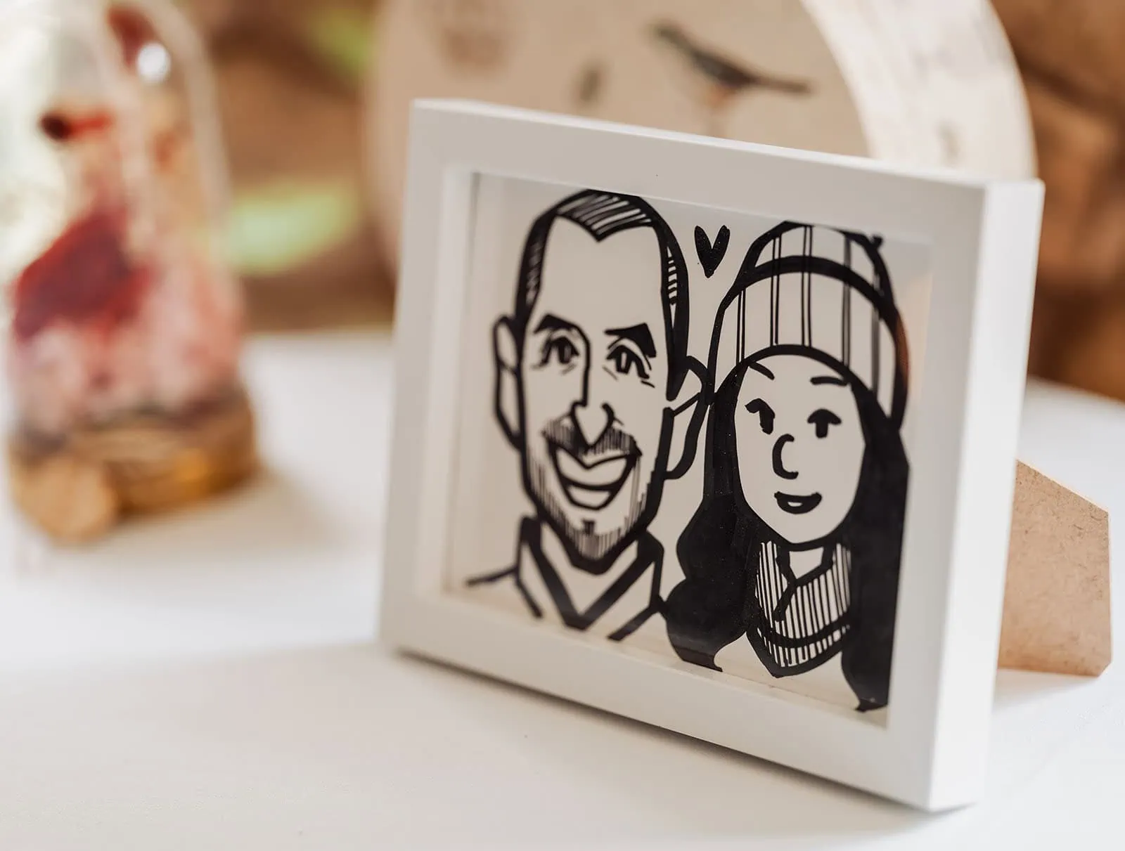 utopia waterfall gully wedding - sally & ben 251 Framed sketch of a couple embracing, intimate art, romantic drawing.
