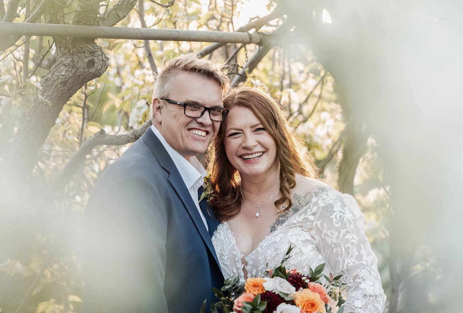 carrick hill wedding - jo & david 307 Romantic couple embracing during golden hour sunset, creating a serene, picturesque moment.
