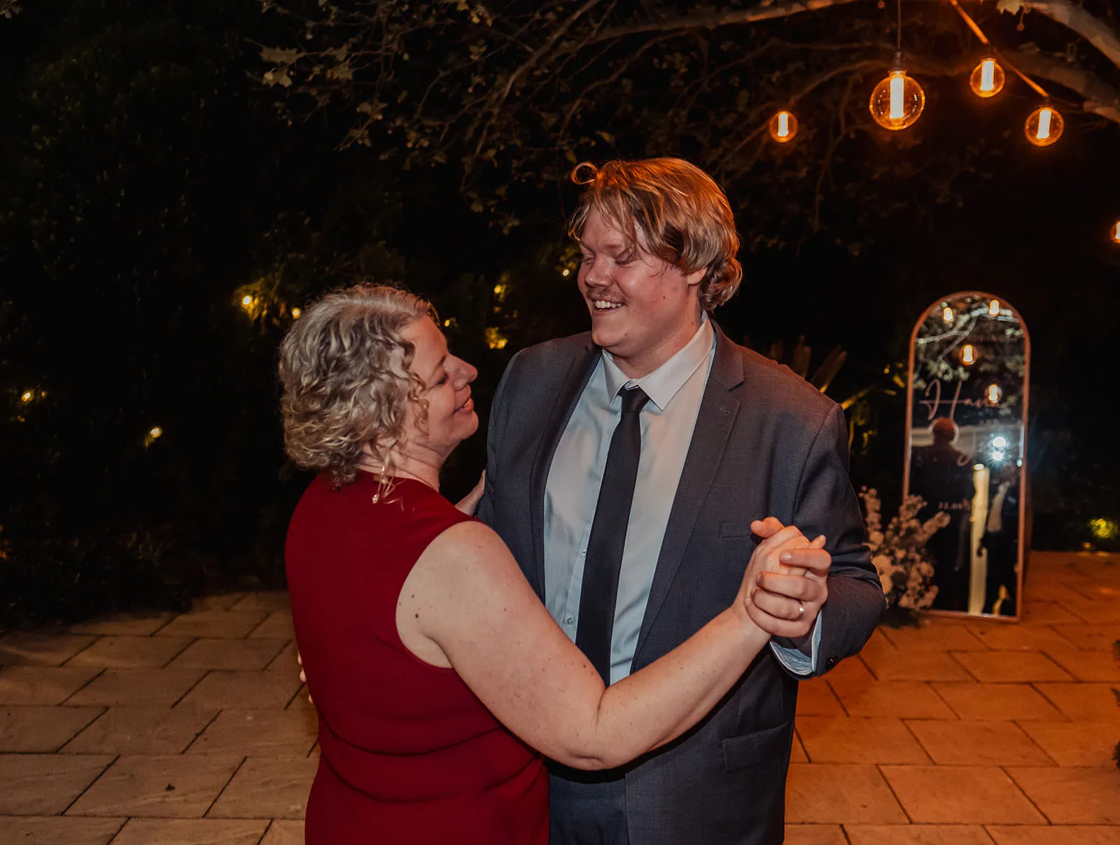 beach rd wines wedding - hana & jessie 98 Couple dancing joyfully at a celebration.