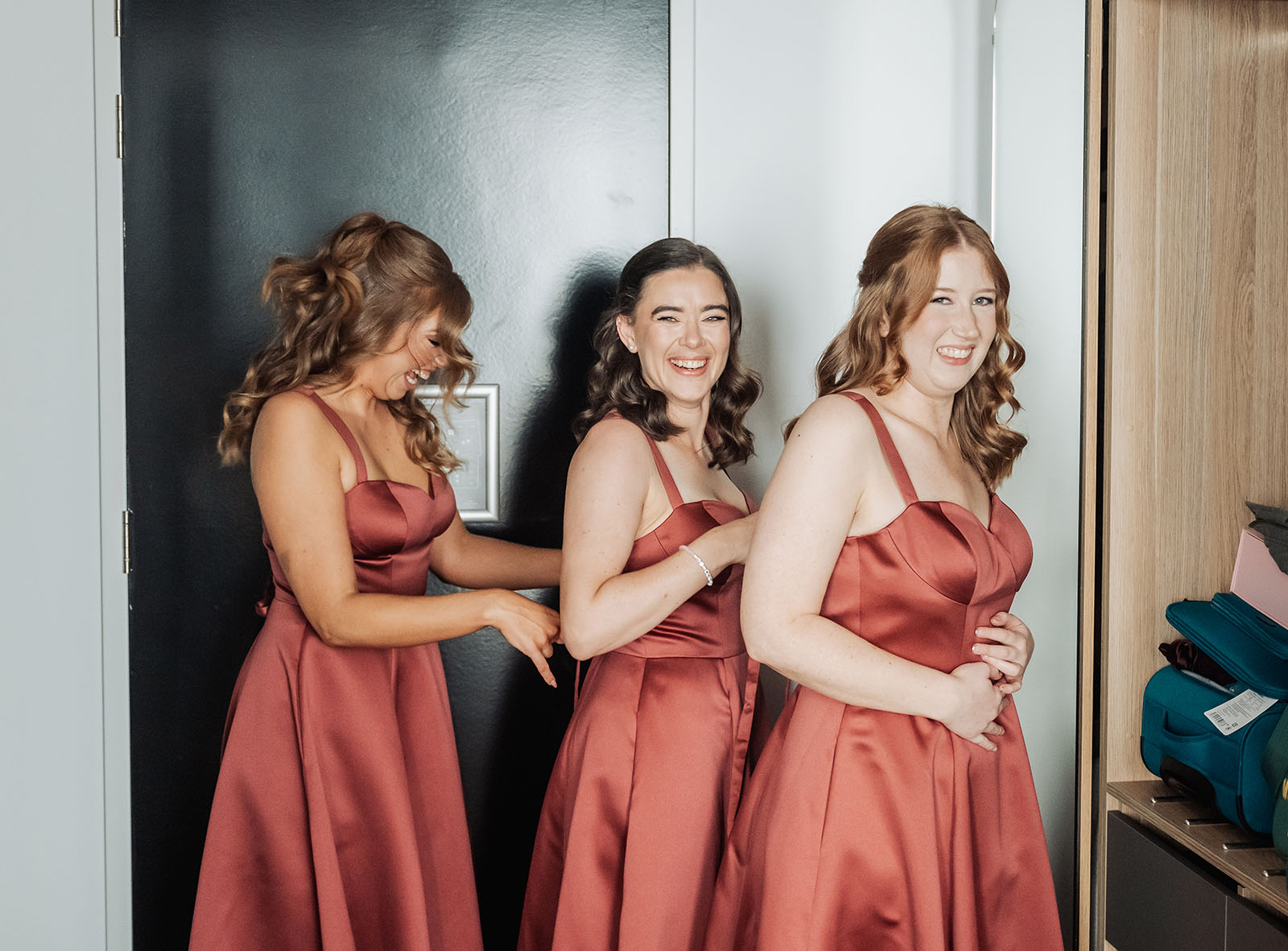 adelaide botanic gardens summerhouse wedding - belinda & ian 143 Elegant women in evening gowns preparing for an event.