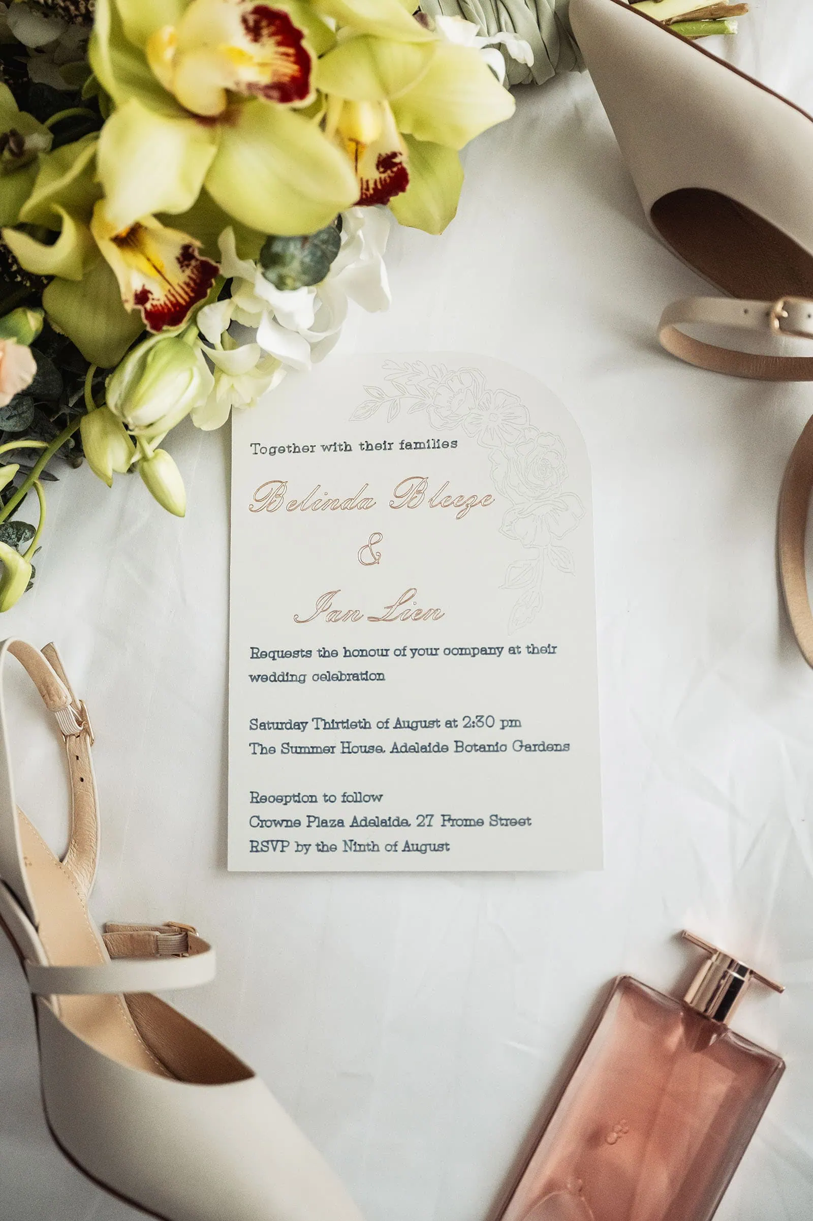 adelaide botanic gardens summerhouse wedding - belinda & ian 138 Elegant wedding invitation with floral design and cursive script.