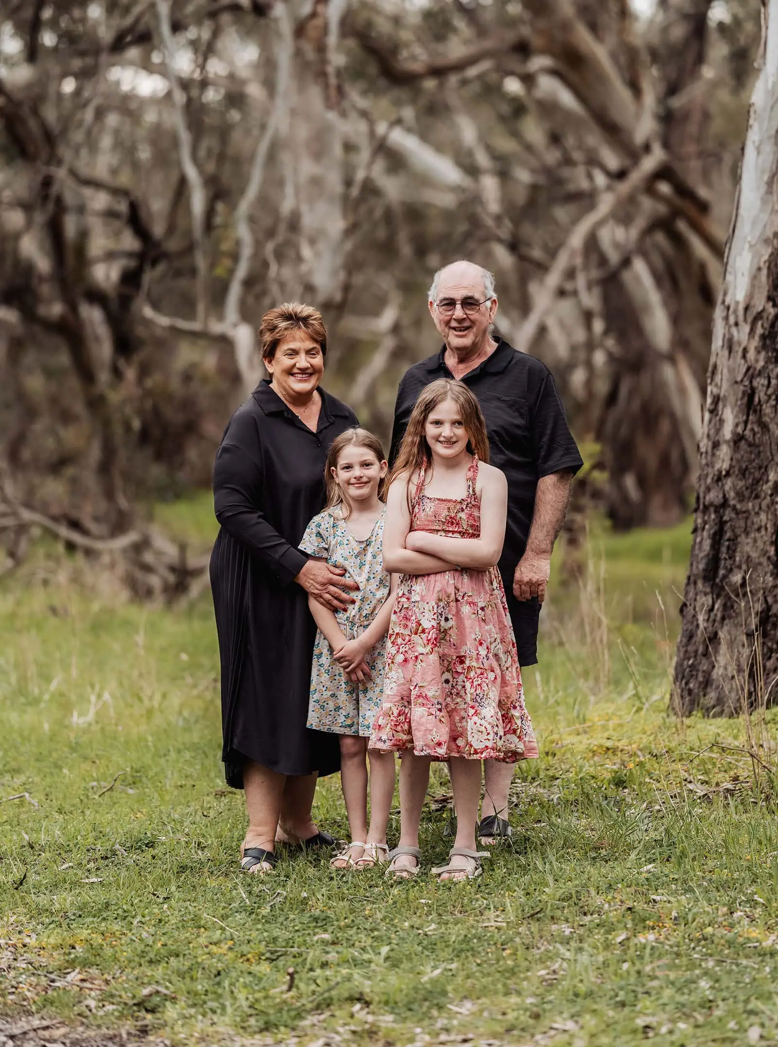 myponga family photography 10 Happy family smiling together outdoors in a sunny park.