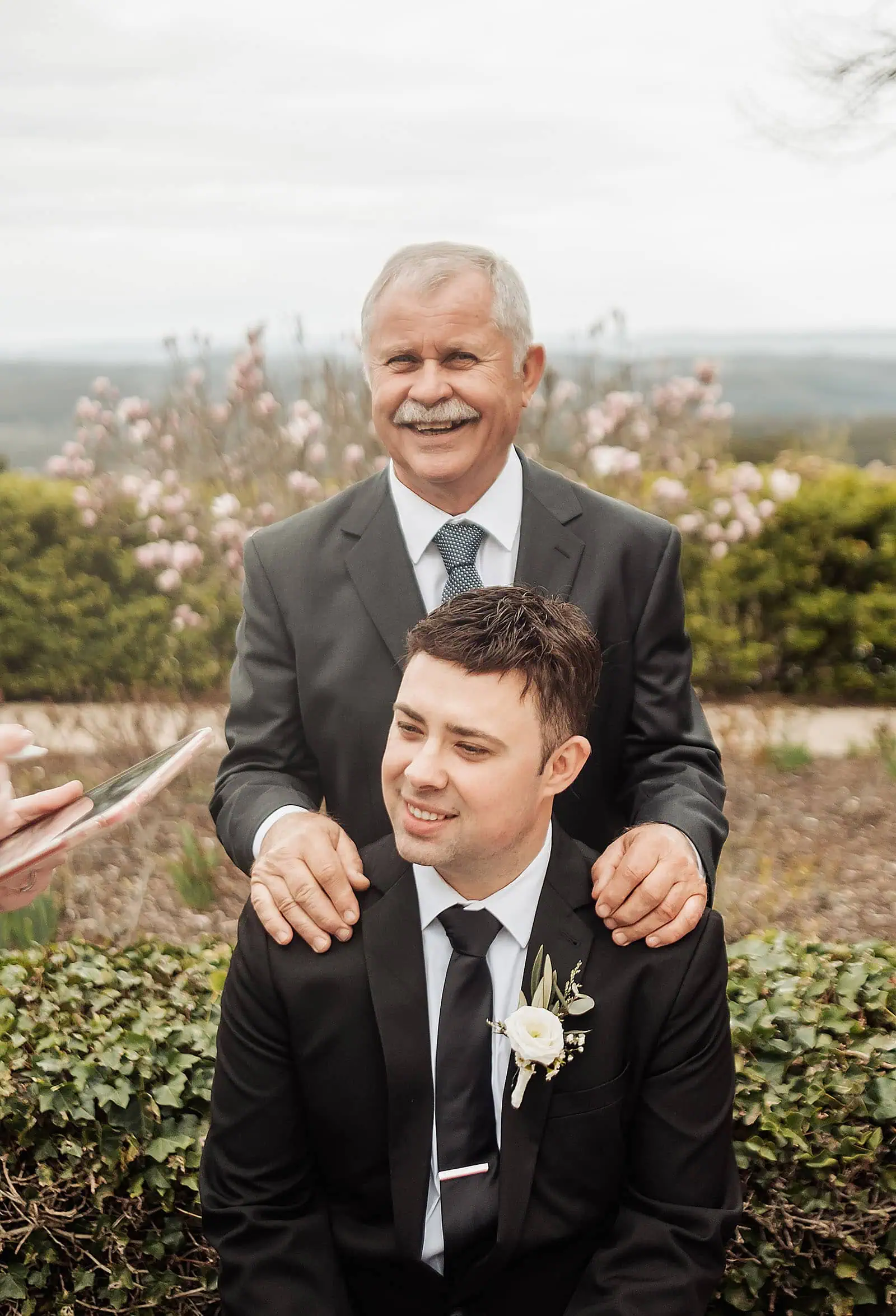 mt lofty house elopement - kimberley & michael 185 Father and son sharing a bonding moment in nature, enjoying quality time together.