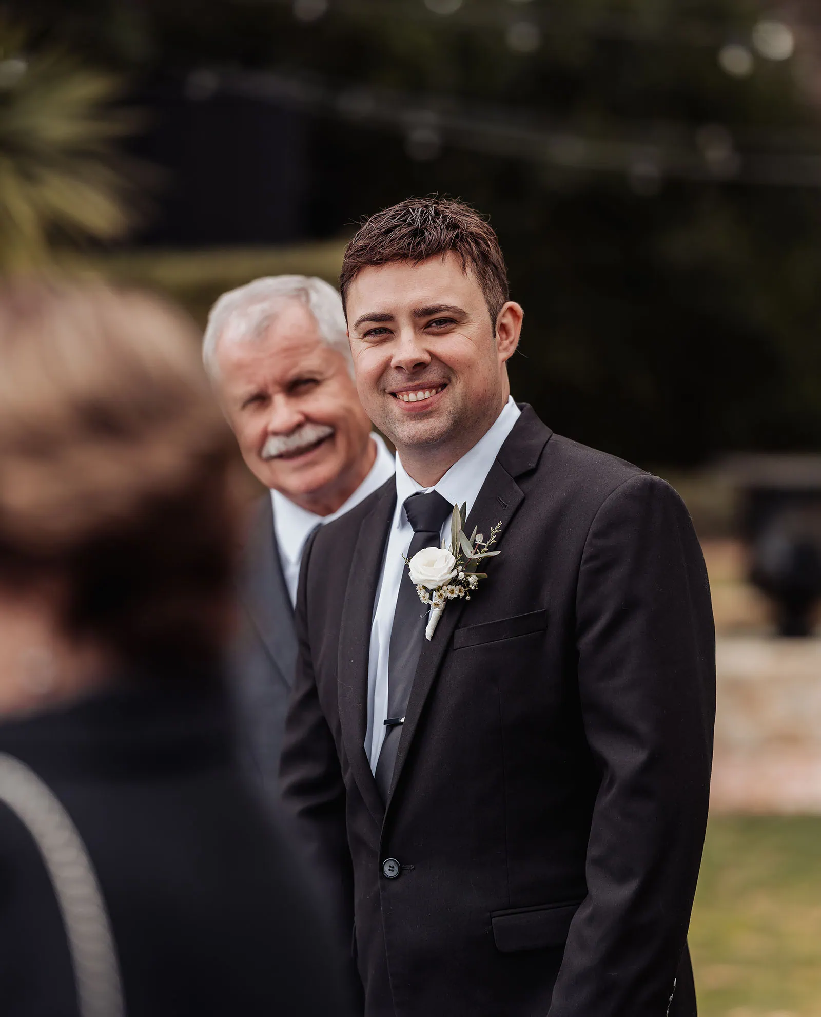 mt lofty house elopement - kimberley & michael 175 Father and son sharing a joyful moment on wedding day.