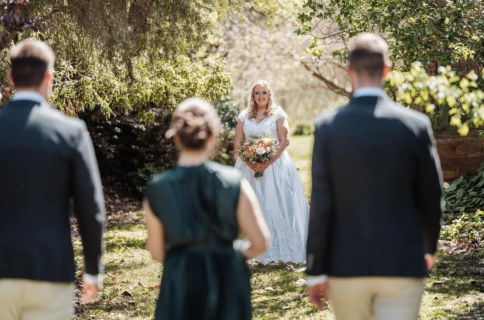 grand cru estate wedding - isabella & nick 116 Elegant garden wedding ceremony with floral decorations and guests.