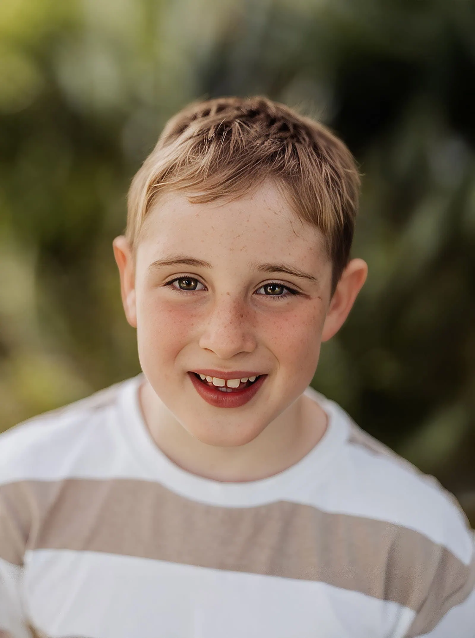 southern parklands family photography 41 Happy boy enjoying outdoor nature adventure, smiling and playful.