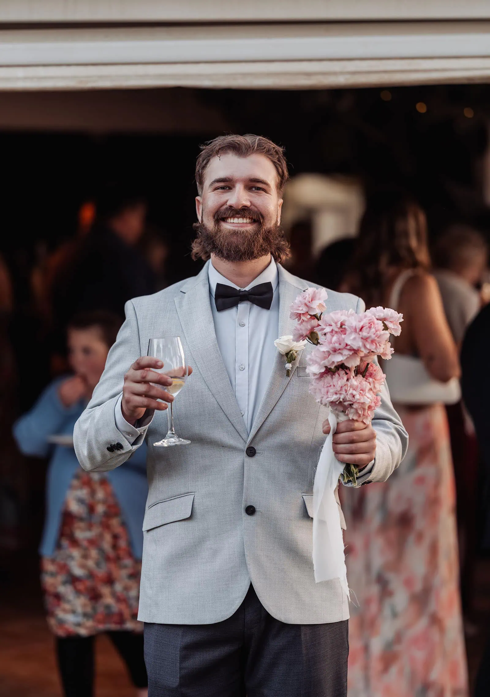 beach rd wines wedding - hana & jessie 73 Festive gathering with happy people celebrating in vibrant colors.