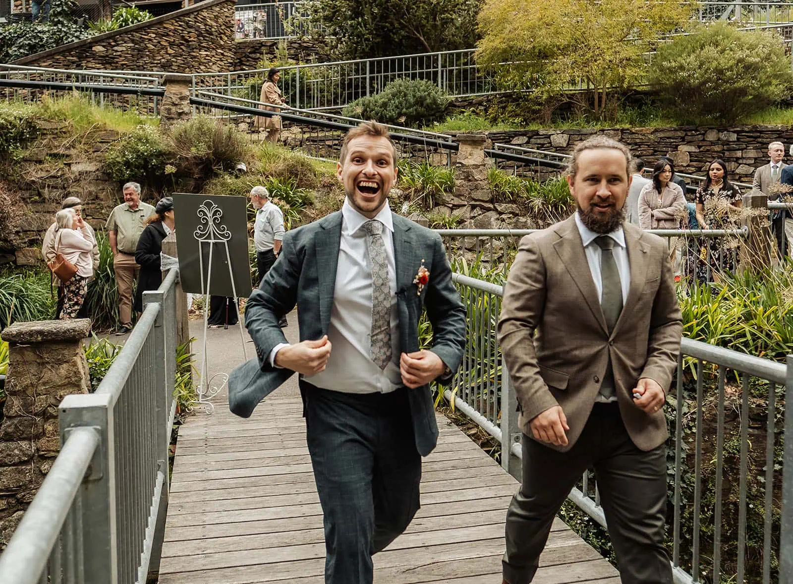 utopia waterfall gully wedding - sally & ben 219 Guests Celebrating on Wooden Bridge in Nature.