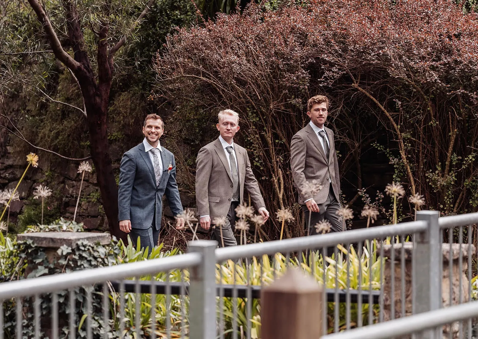 utopia waterfall gully wedding - sally & ben 218 Men strolling in lush garden, enjoying natures tranquility.