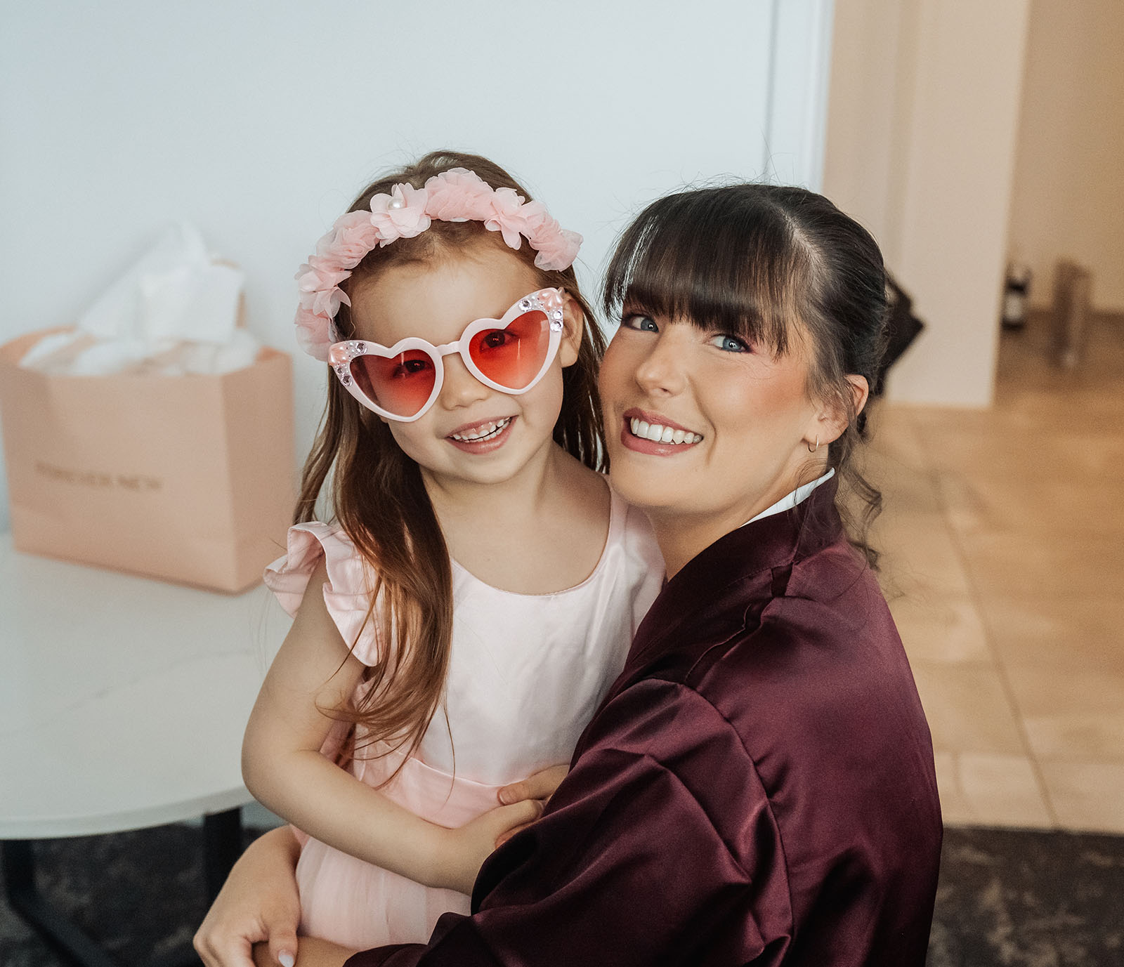 adelaide botanic gardens summerhouse wedding - belinda & ian 142 Mother and daughter laughing together outdoors, joyful family bonding moment.