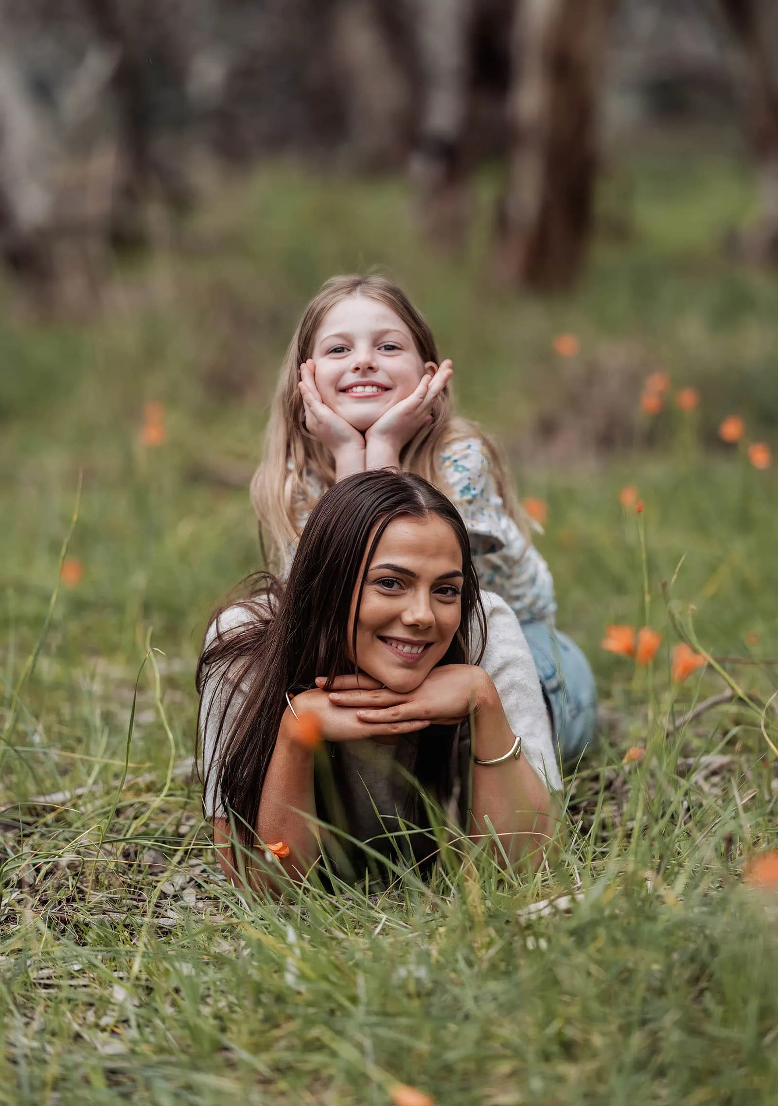 myponga family photography 19 Mother and daughter smiling together in a sunny meadow.