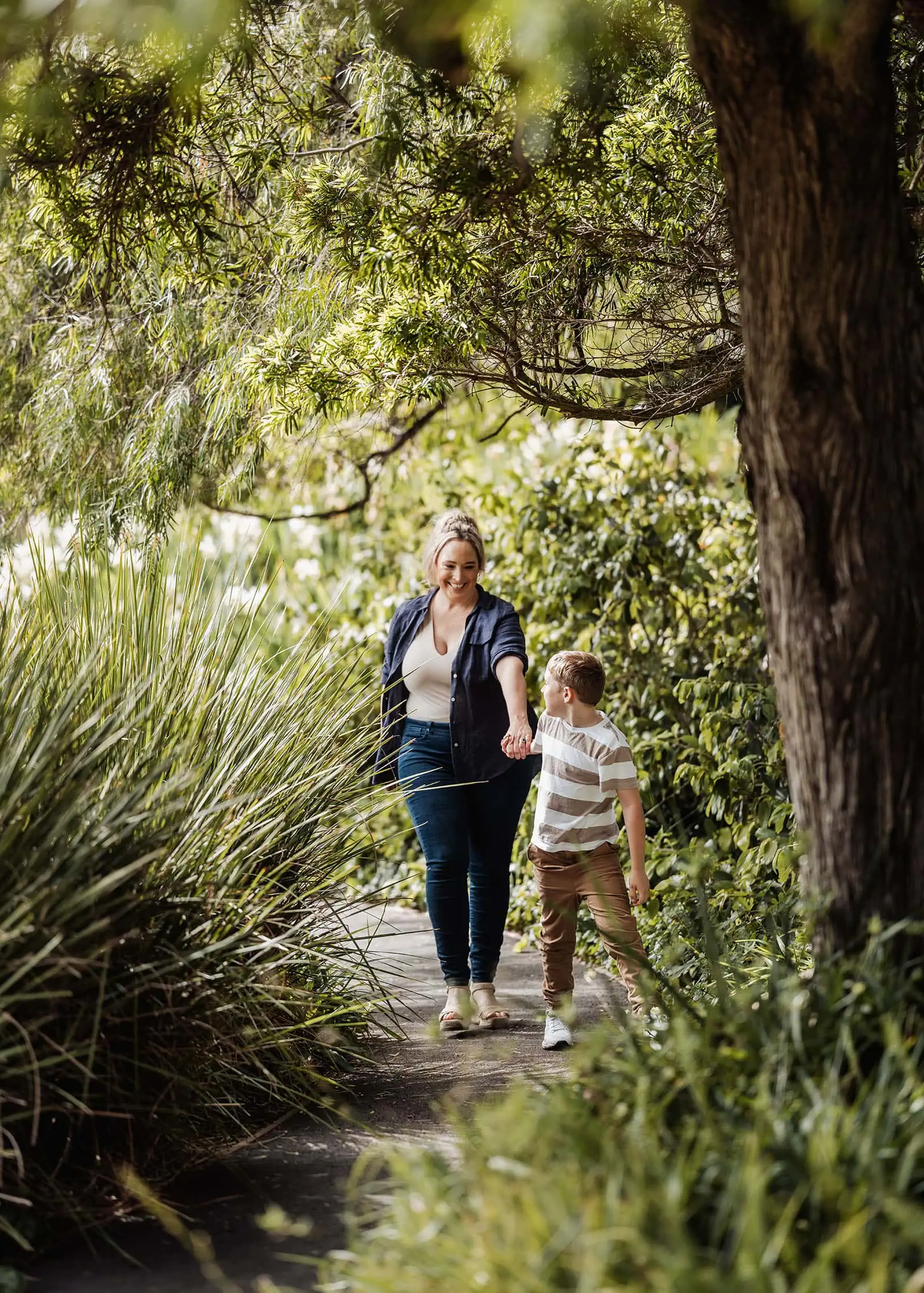 southern parklands family photography 40 Mother and son enjoying a peaceful nature walk together.