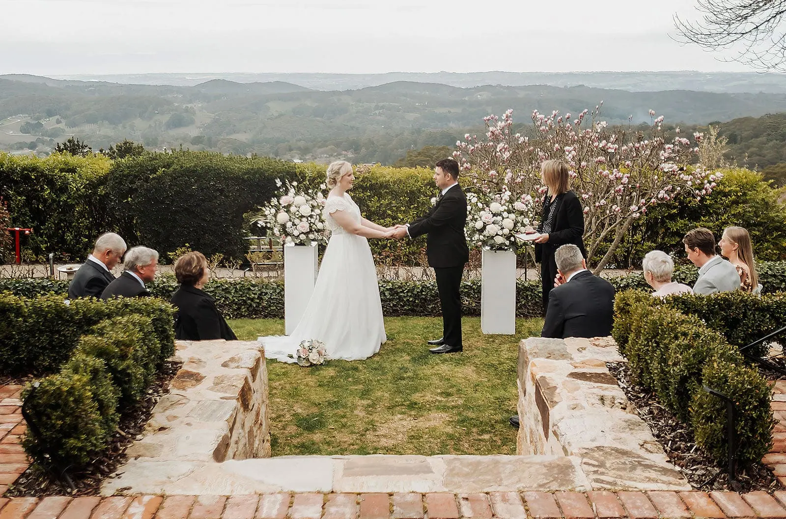 mt lofty house elopement - kimberley & michael 180 Intimate outdoor wedding ceremony under twilight sky with elegant decor.