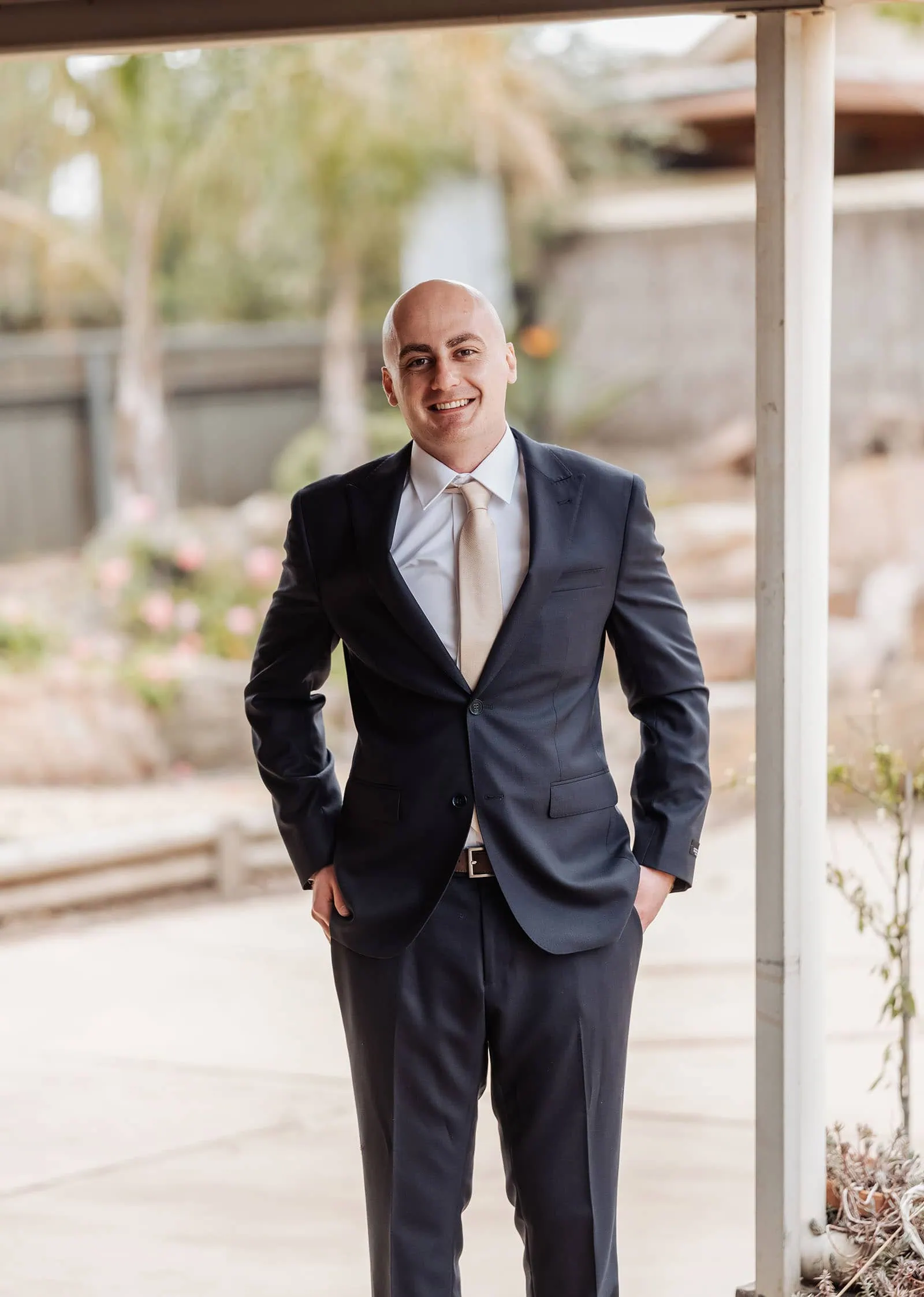 grand cru estate wedding - isabella & nick 100 Professional outdoor portrait of a confident businessperson in natural light.