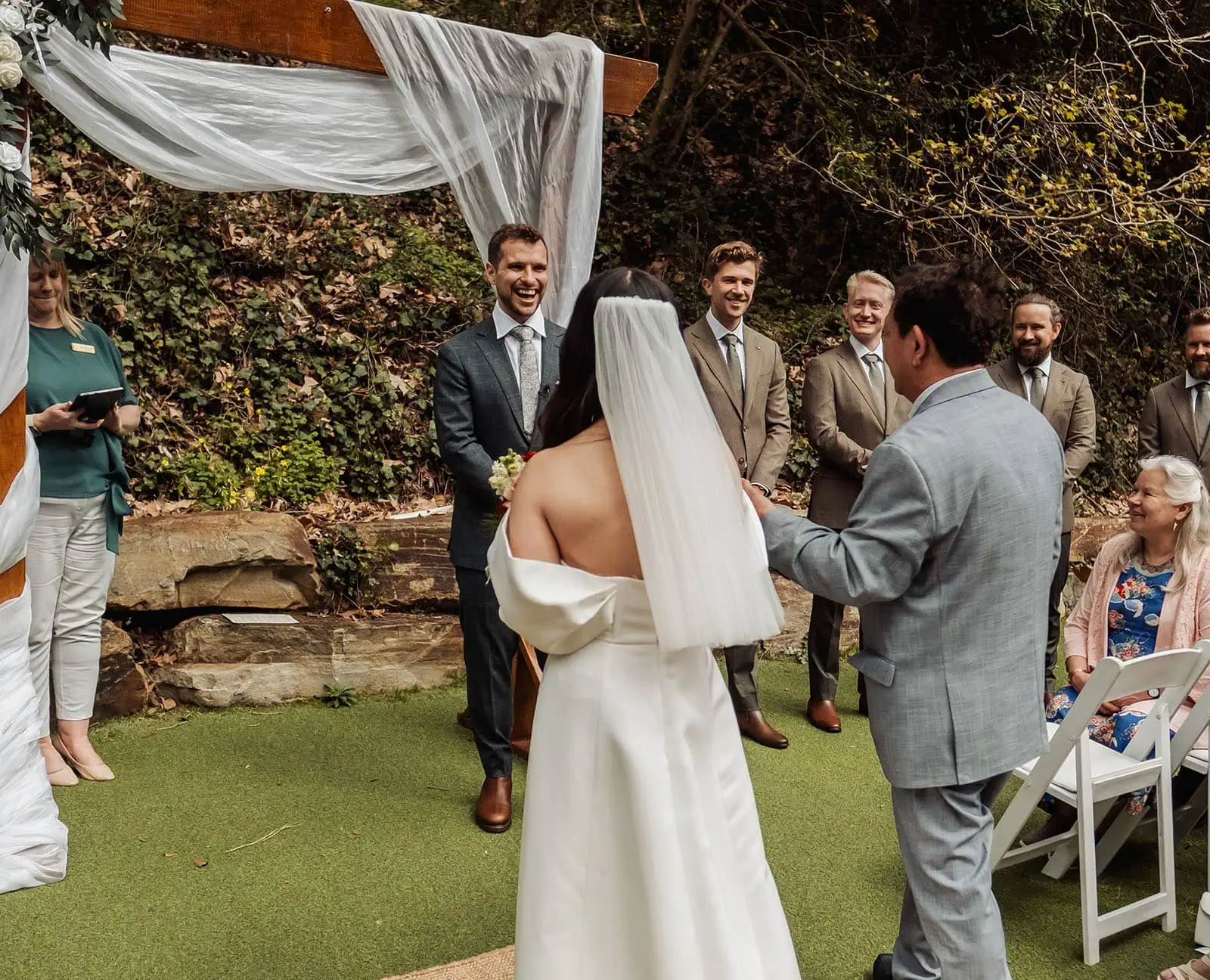 utopia waterfall gully wedding - sally & ben 220 Outdoor wedding ceremony in a picturesque garden setting.