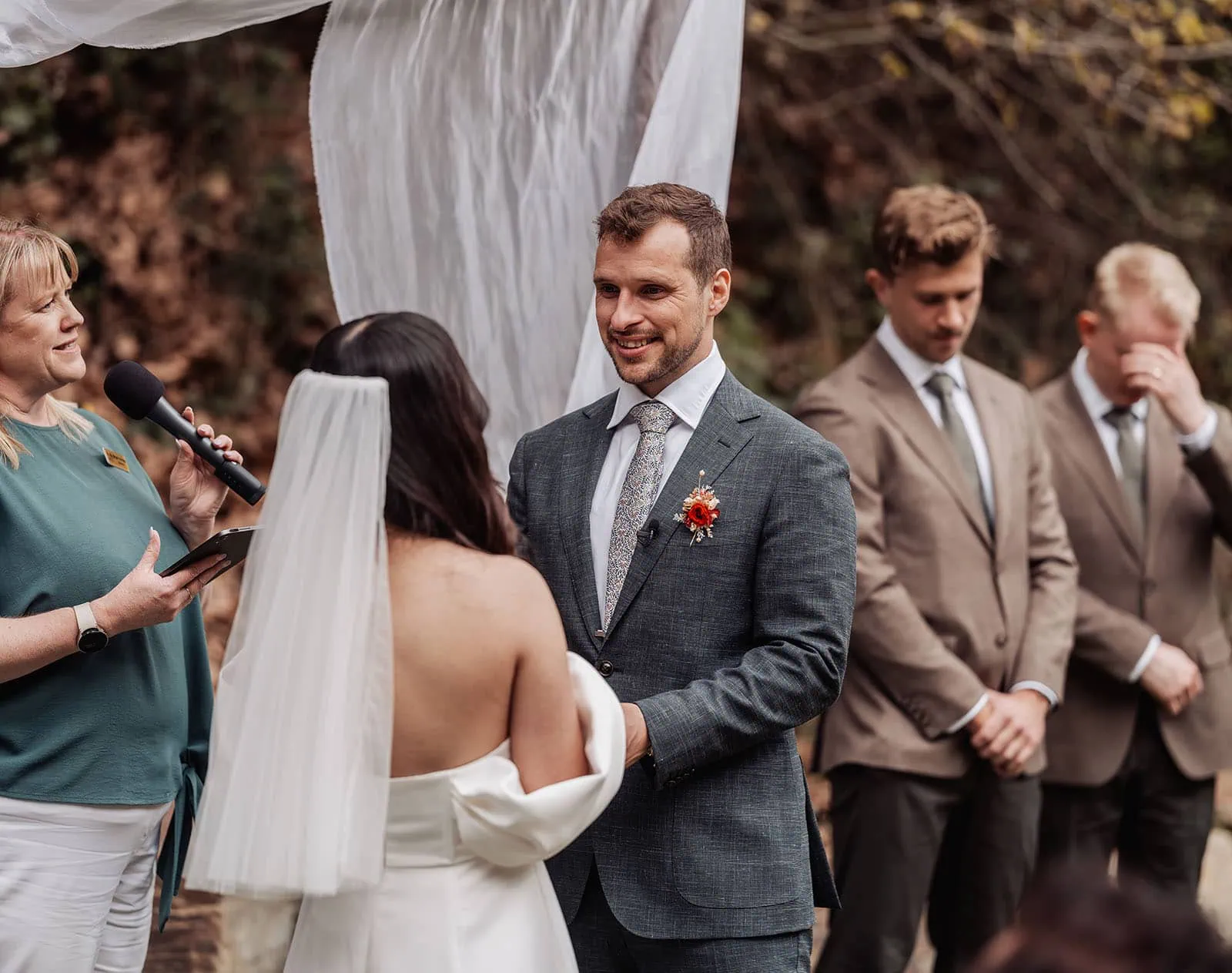 utopia waterfall gully wedding - sally & ben 223 Scenic outdoor wedding ceremony set against a lush garden backdrop.