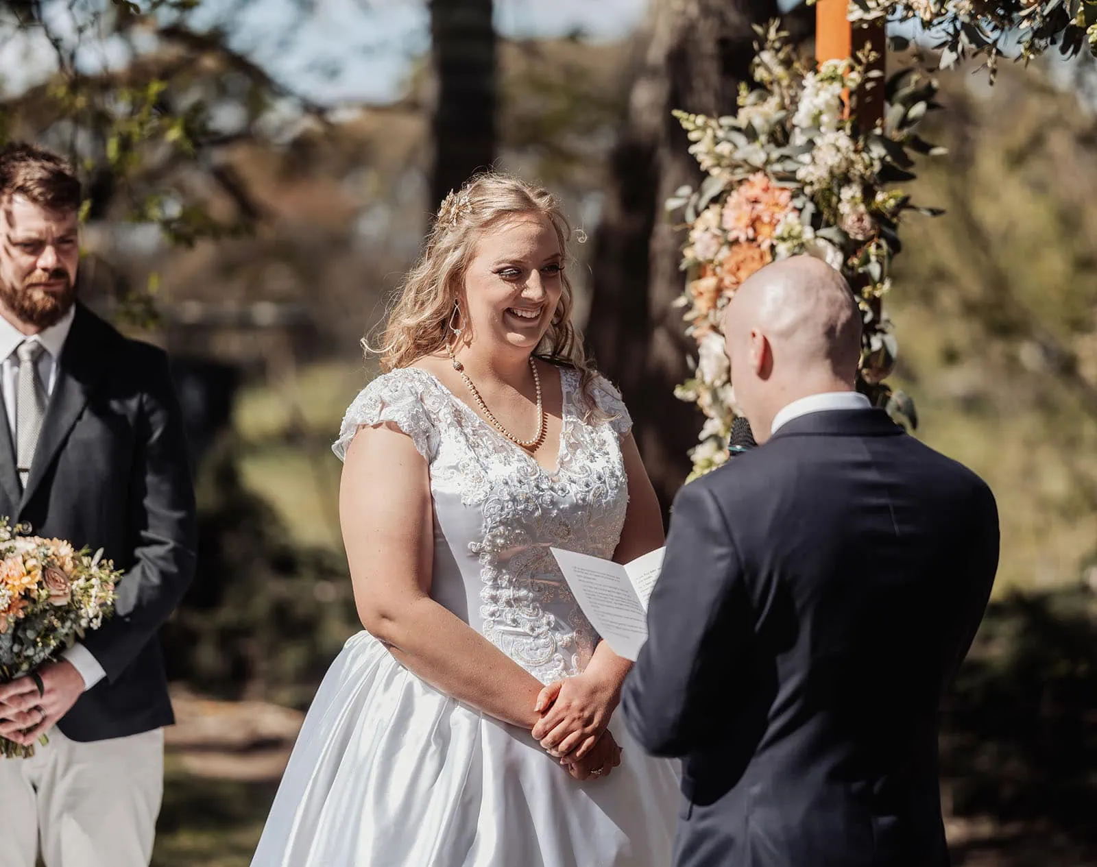 grand cru estate wedding - isabella & nick 126 Elegant outdoor wedding ceremony with scenic backdrop and beautifully arranged seating.