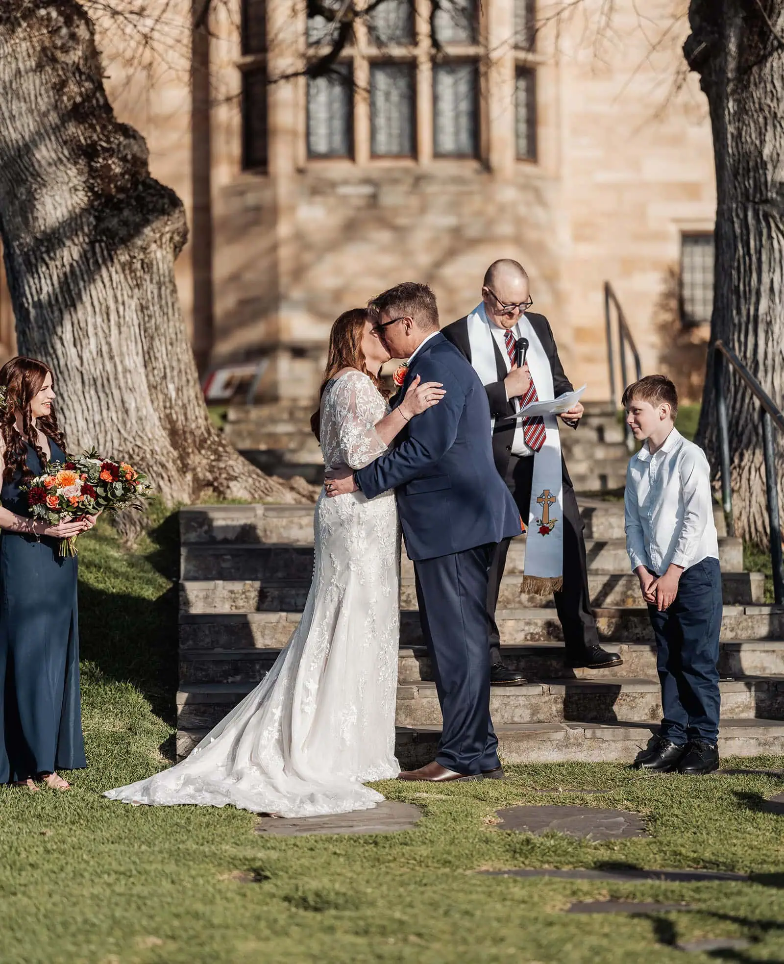 carrick hill wedding - jo & david 295 Outdoor wedding ceremony with floral decorations and guests seated.