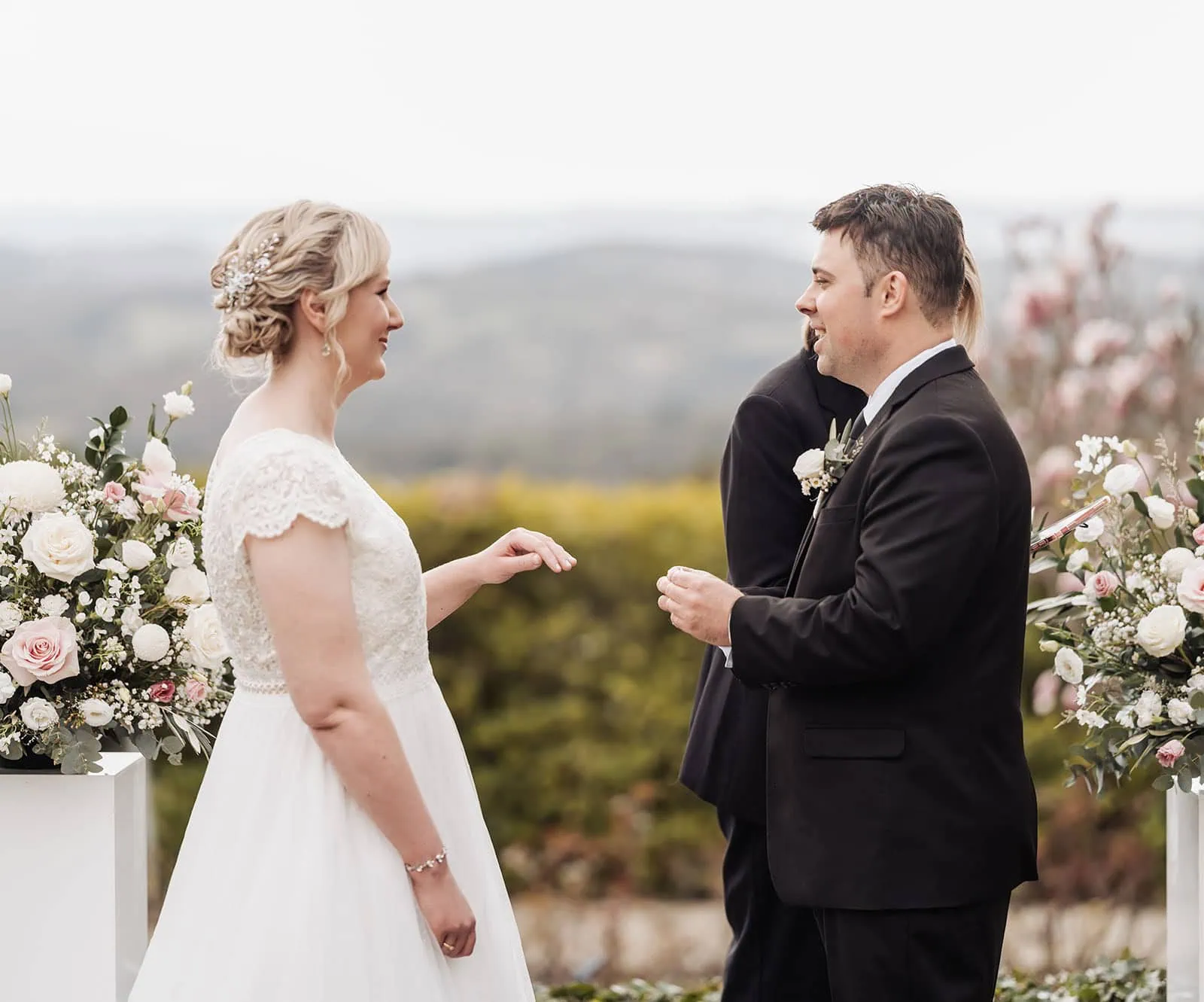 mt lofty house elopement - kimberley & michael 183 Outdoor wedding ceremony with nature backdrop and elegant decorations.